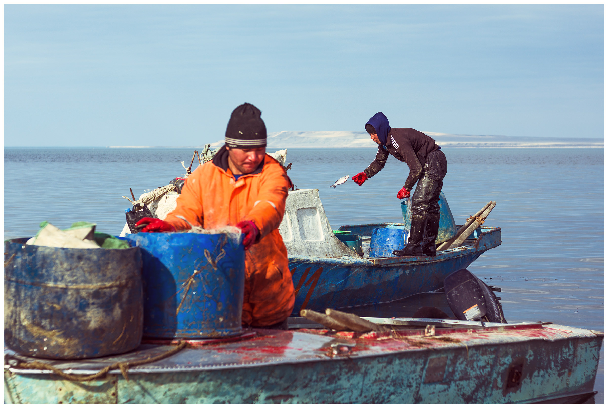 Fishermen unload their catch