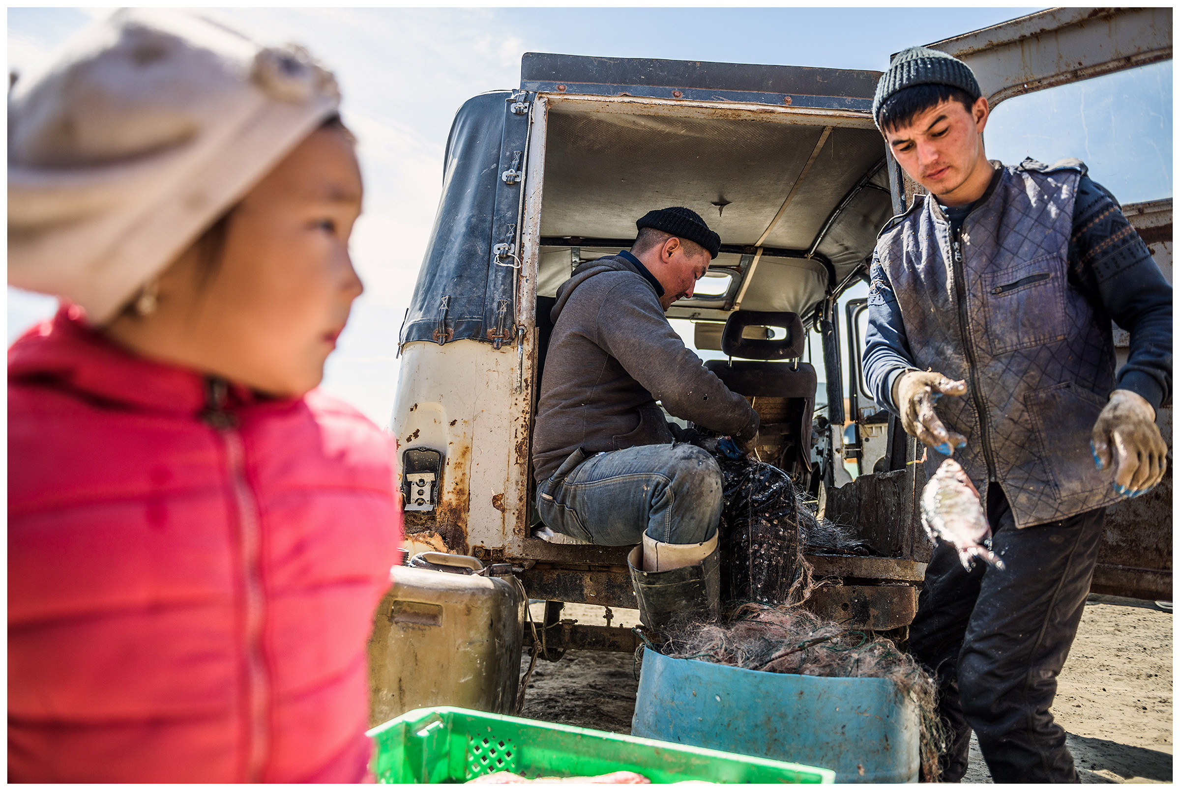 Fishermen get fish out of the nets