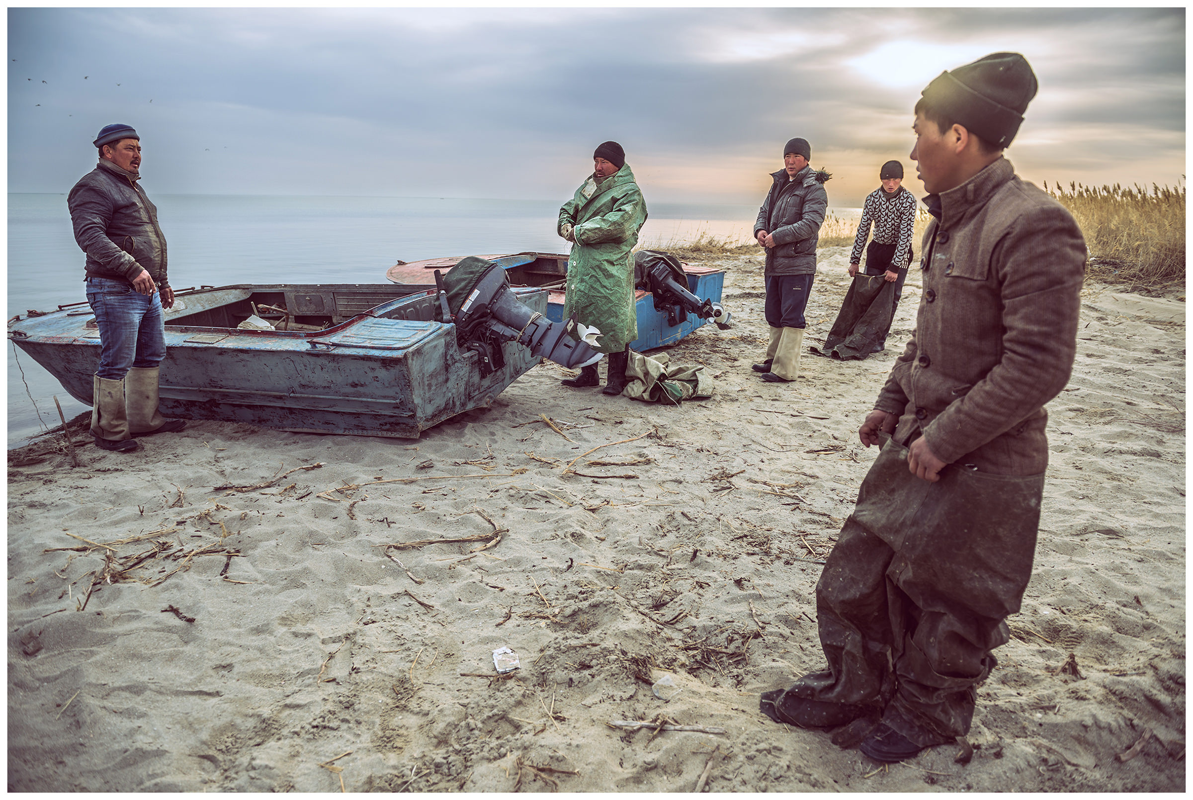 Fishermen change for fishing at the coast of the Aral Sea