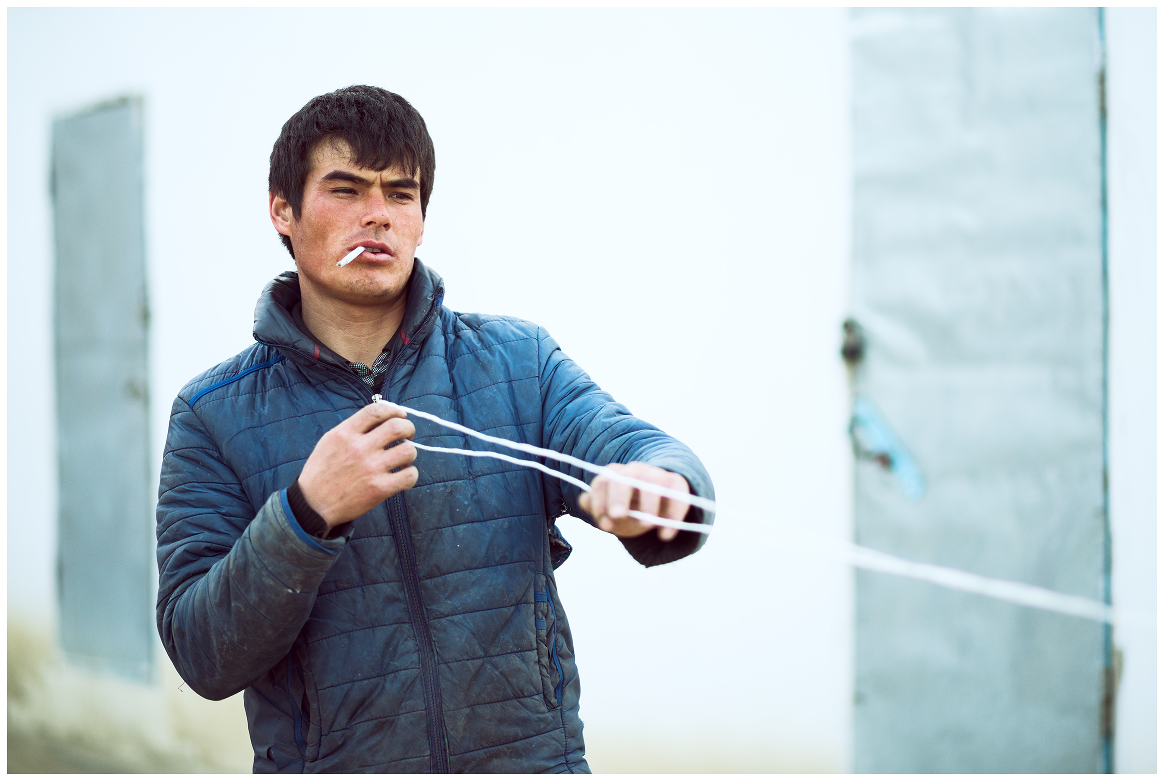 A fisherman makes an anchor out of a rope and a stone
