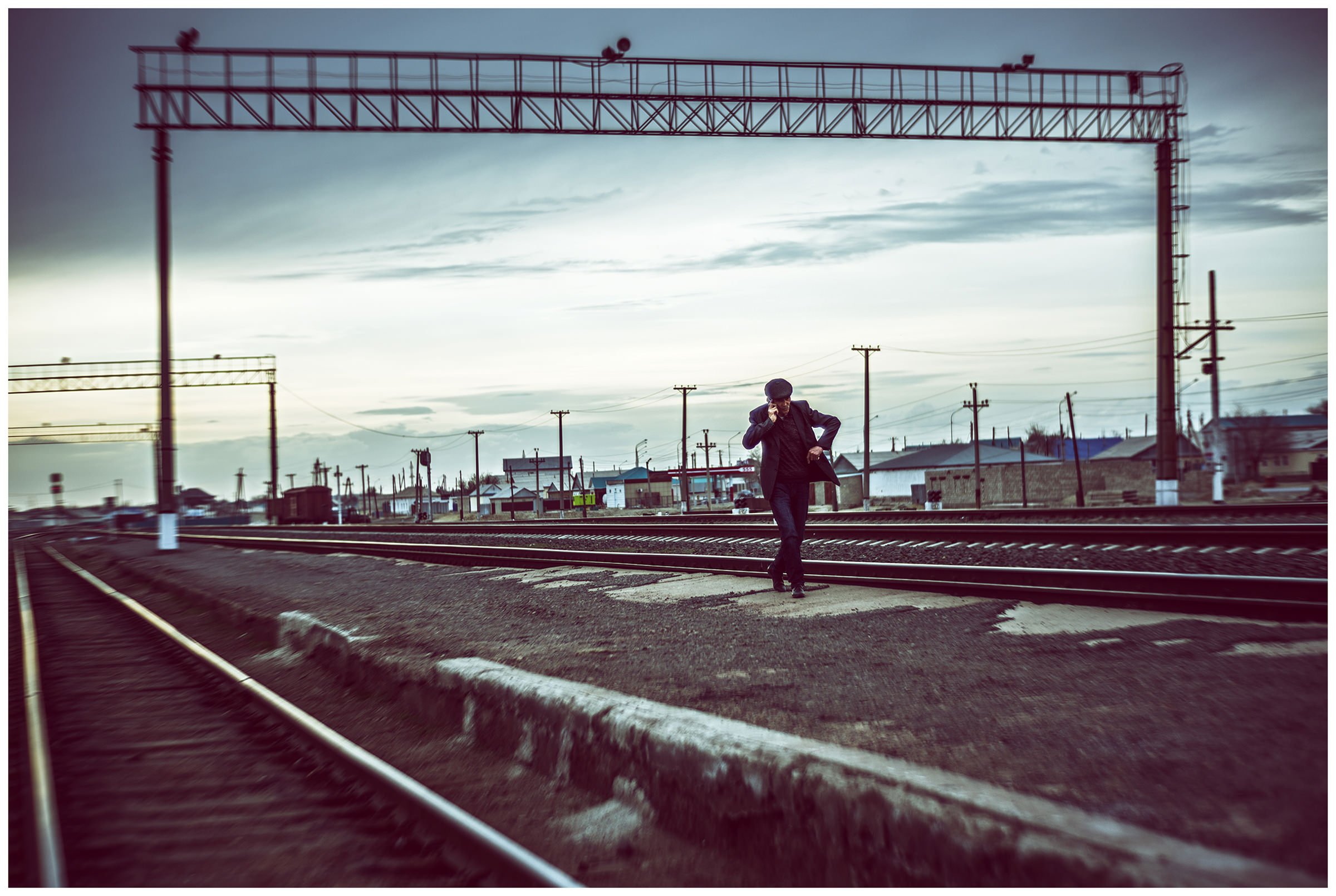 A man walks on a platform in Aral