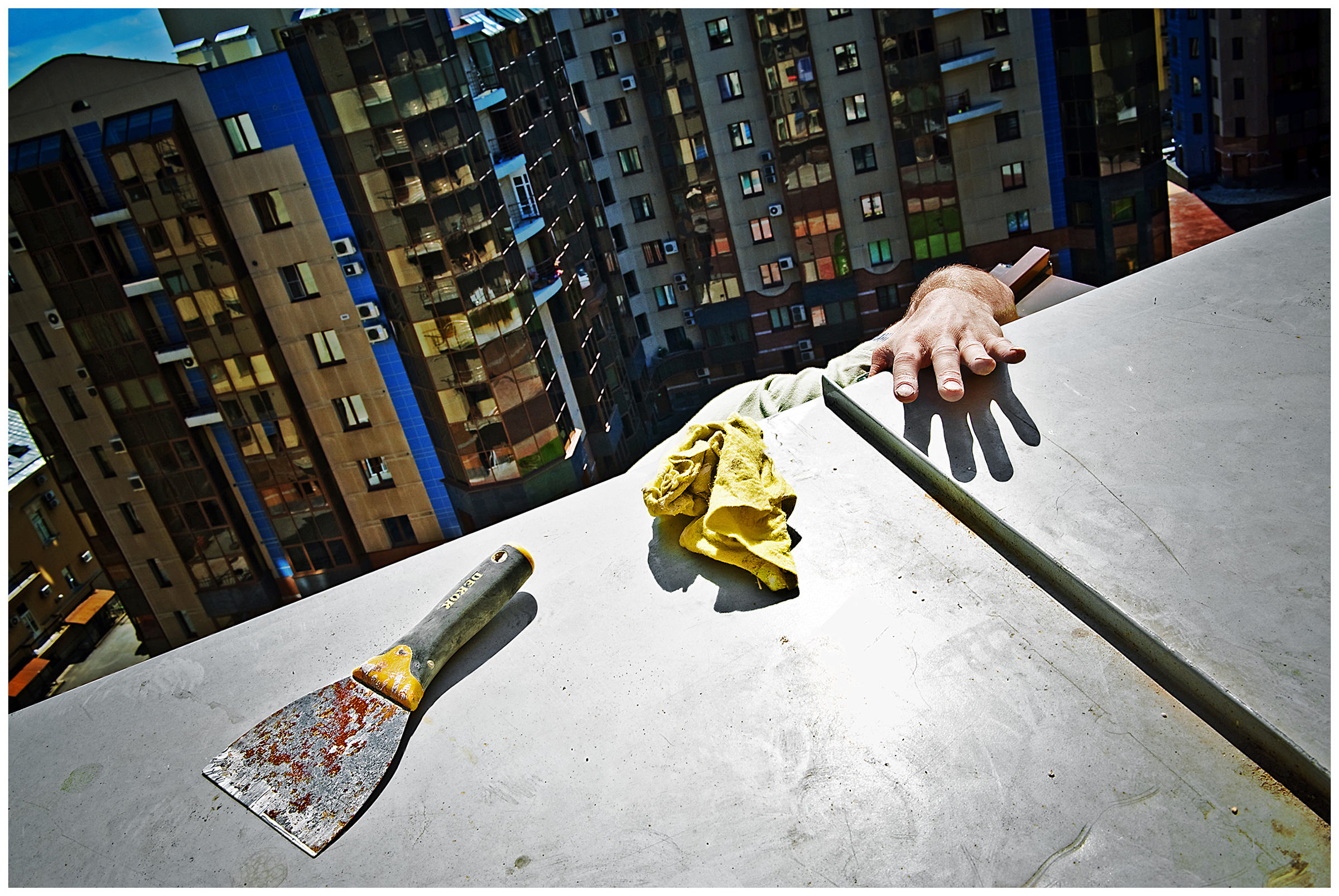 Saint Petersburg, Russia. A guest worker works on a roof.