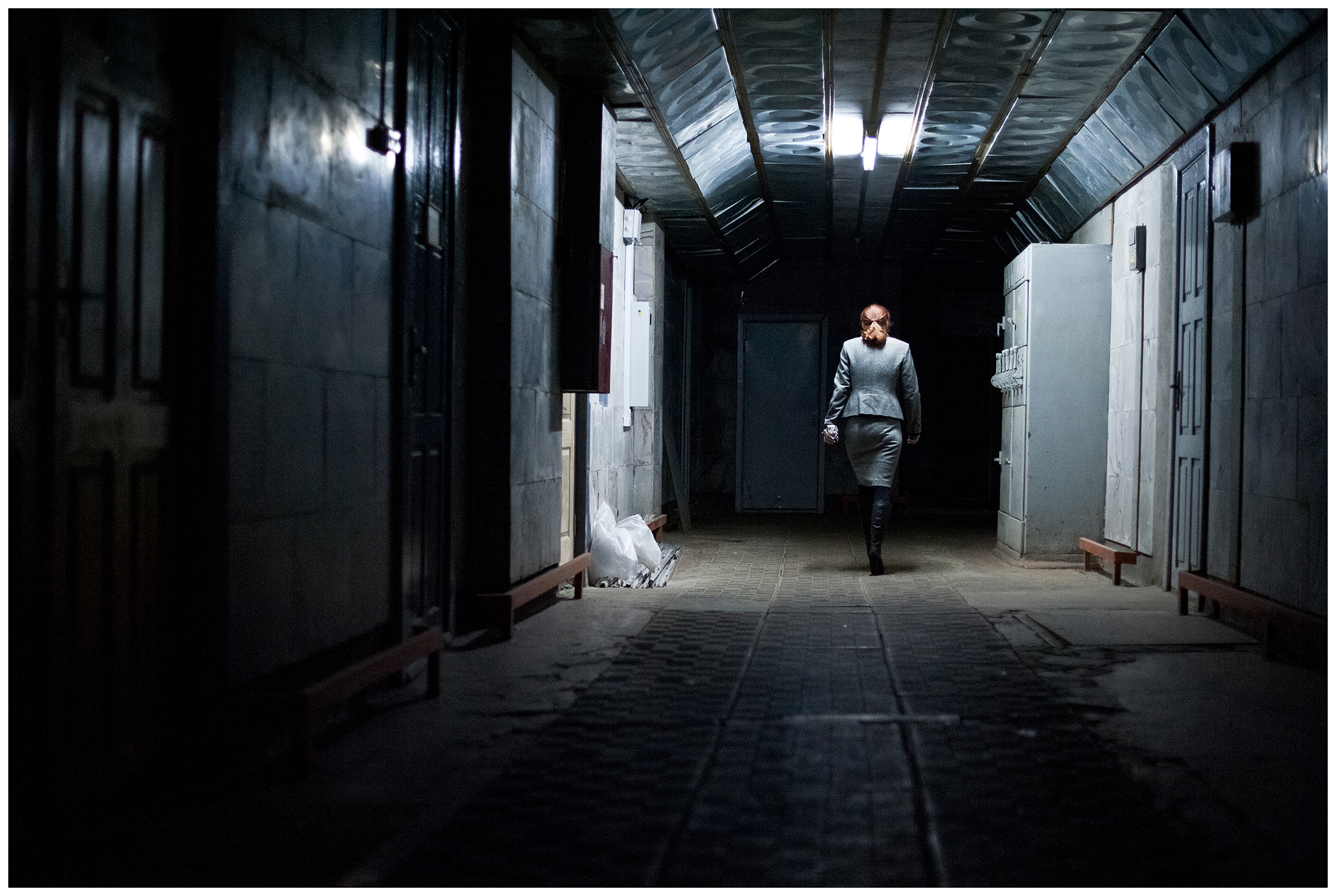 Minsk, Belarus, the publishing house "Pechatny Combinat". An employee passes through a dark corridor in the pressure combine building.
