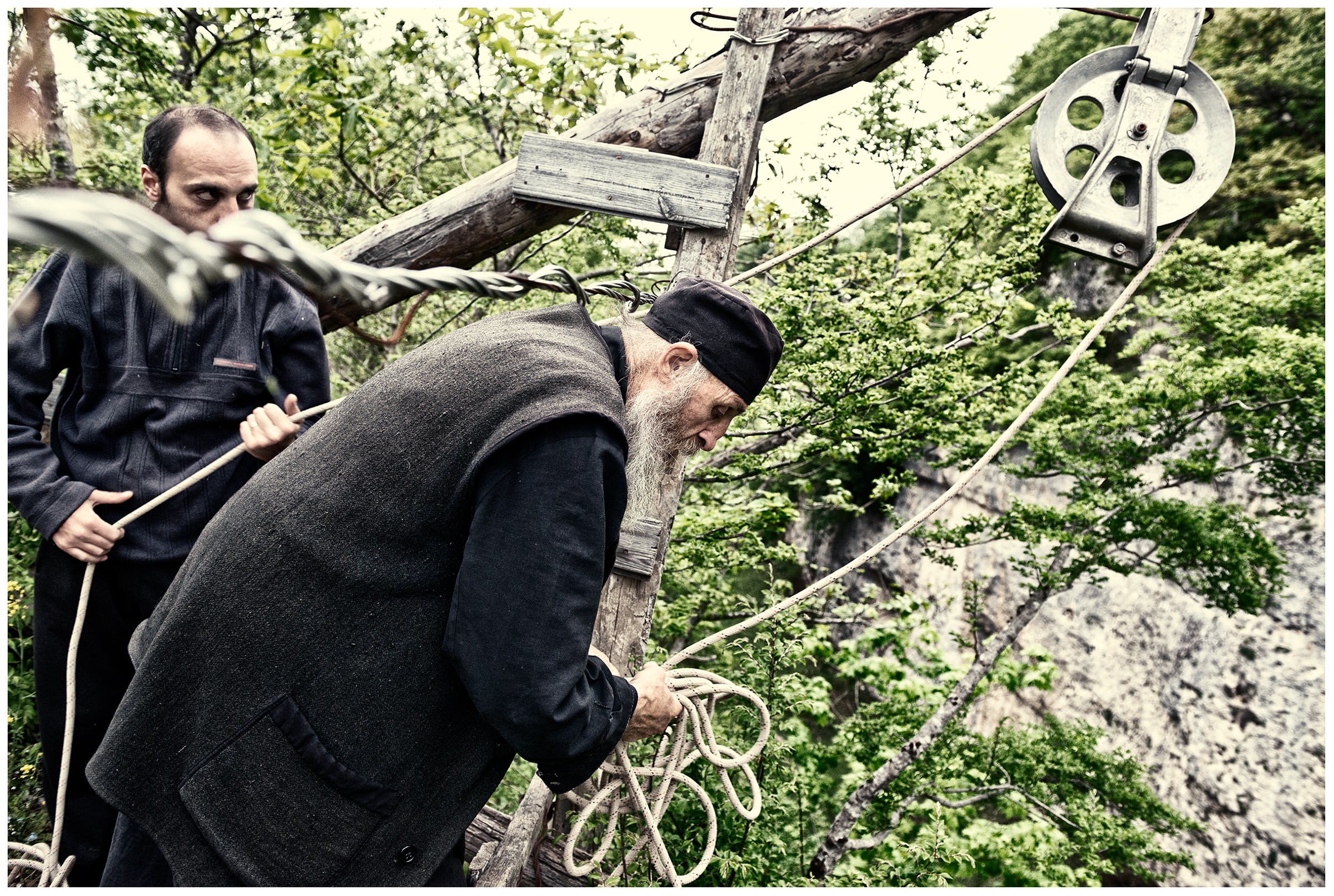 Imereti, Georgia. The Georgian monk Maxime Kavtaradze and his friends build a house on a rock.