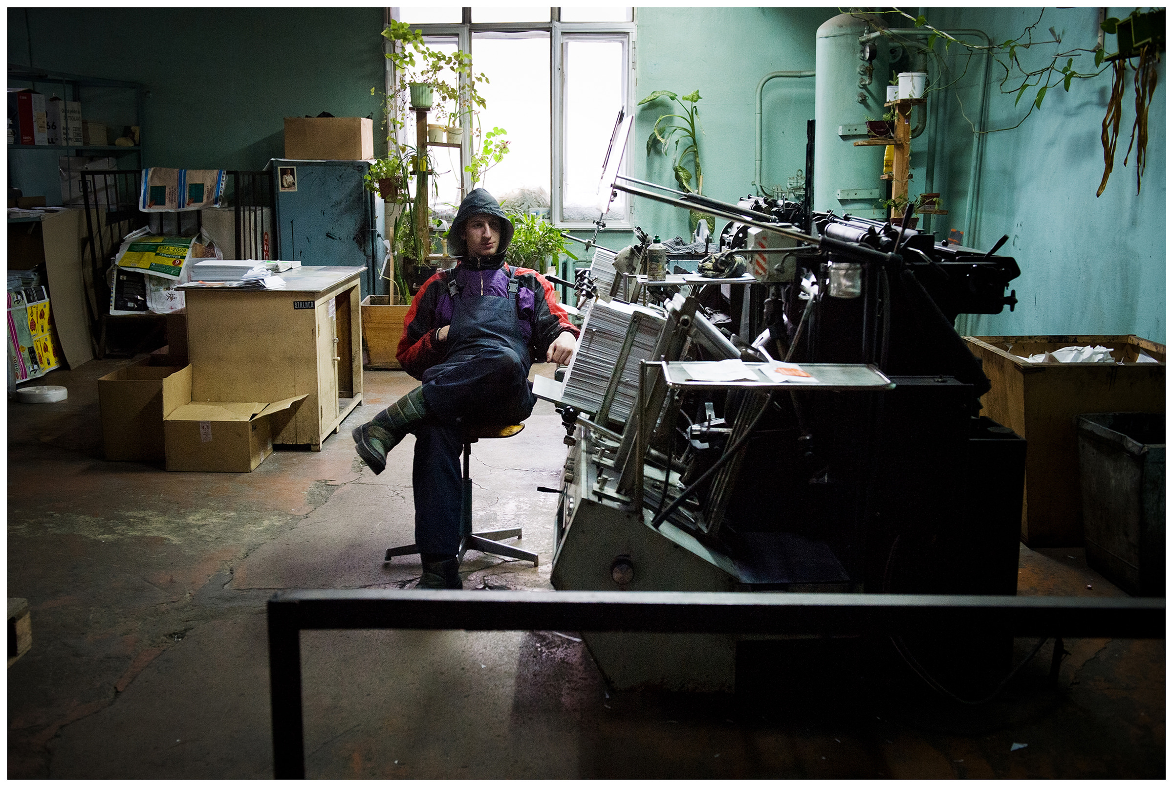 Minsk, Belarus, the publishing house "Pechatny Combinat". A printer controls the printing of the brochures.