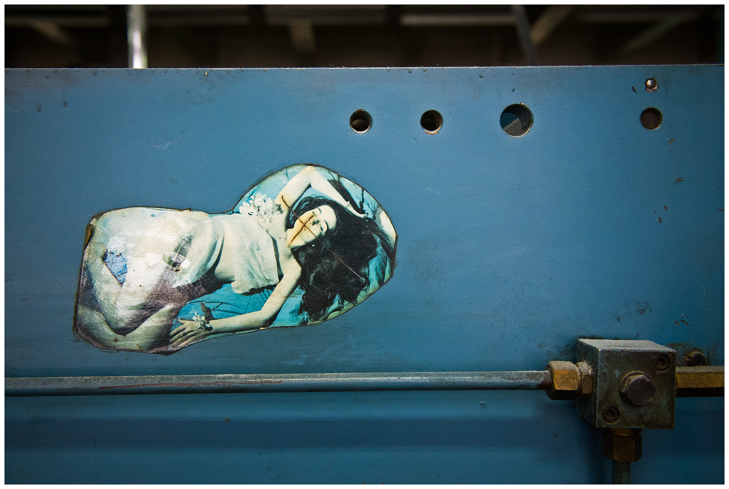 Minsk, Belarus, the publishing house "Pechatny Combinat". A sticker from the former print production is attached to a machine tool.