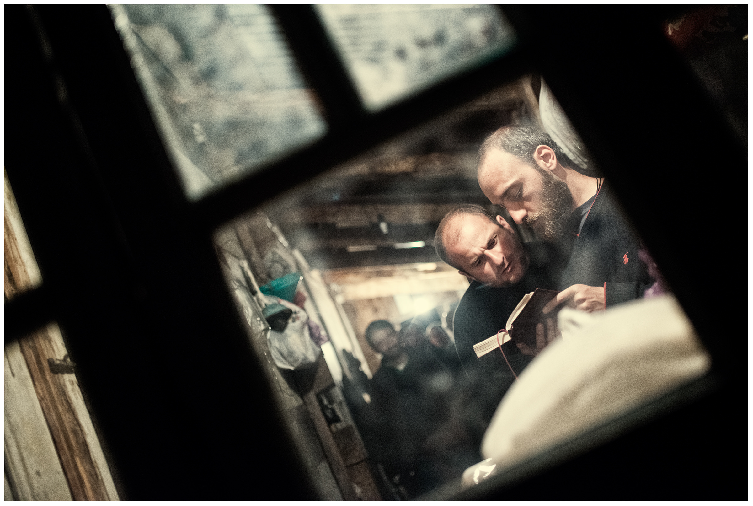 Imereti, Georgia. The Georgian monk Maxime Kavtaradze is bedding with his friends in his house on a rock.
