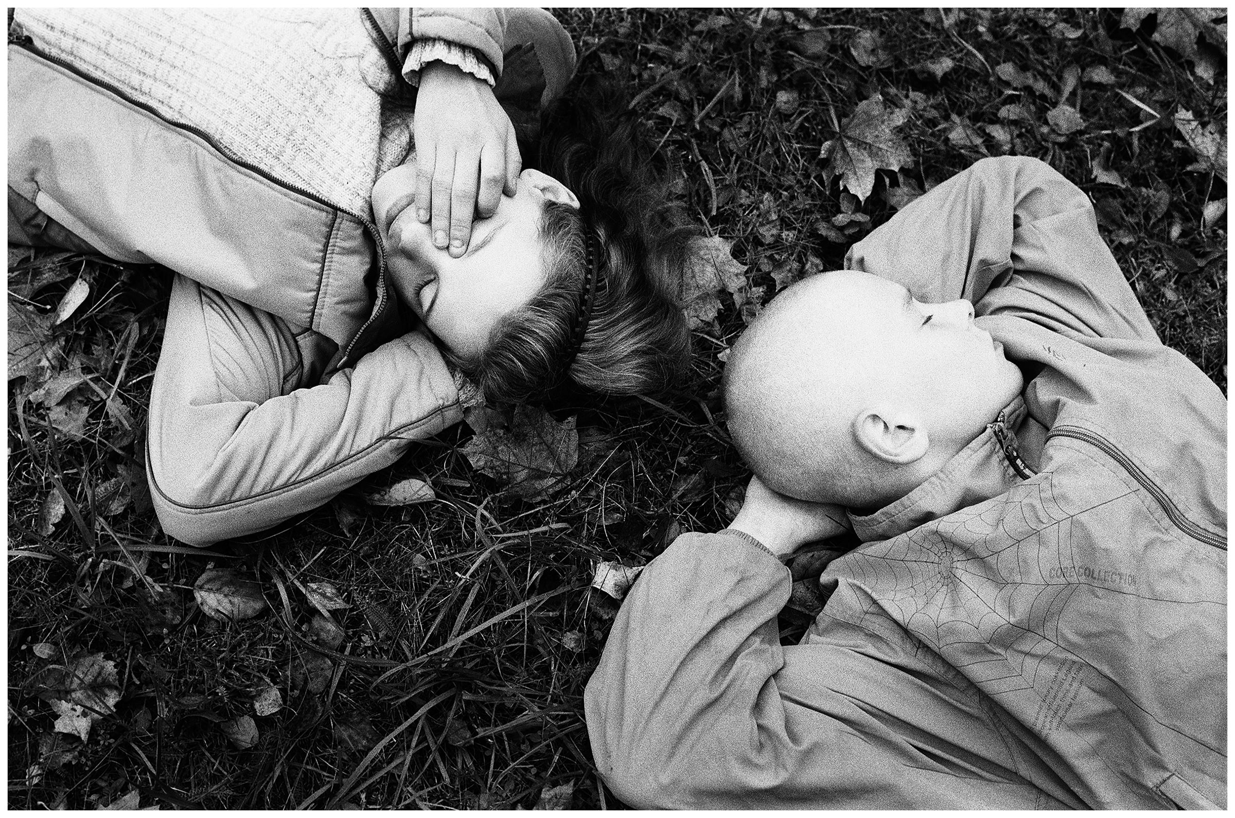 Minsk, Belarus. A girl and a boy recovering from gardening in the yard of a kindergarten.