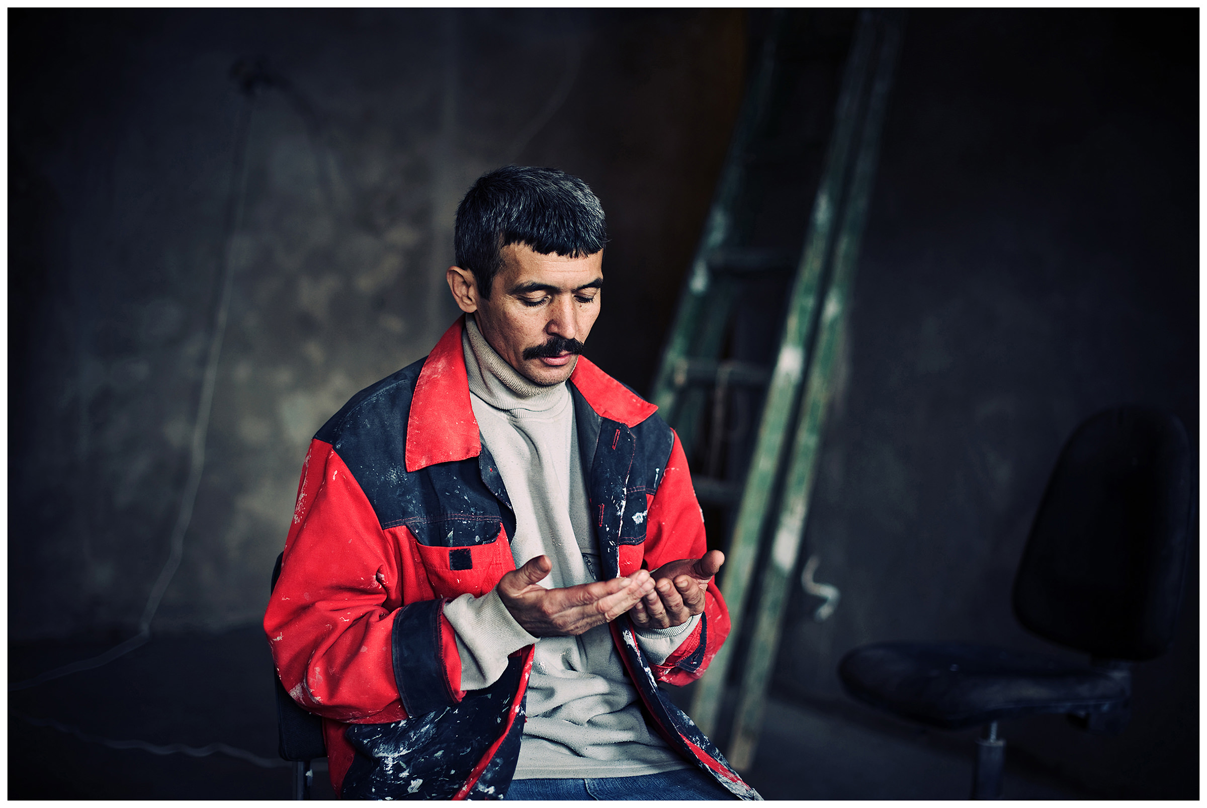 Saint Petersburg, Russia. An Uzbek guest worker prays at a construction site.