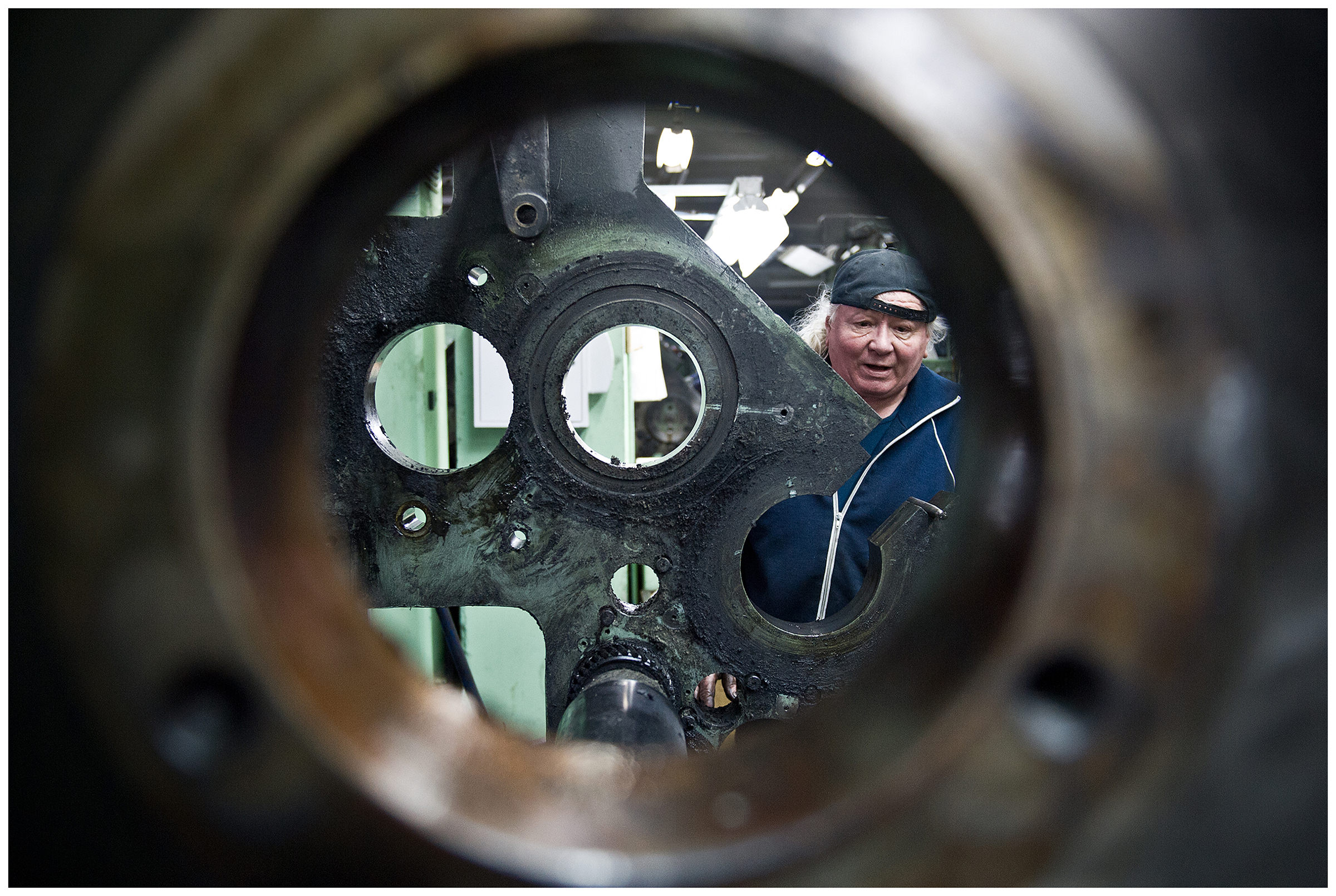 Minsk, Belarus, the publishing house "Pechatny Combinat". A technician repairs a printing press.