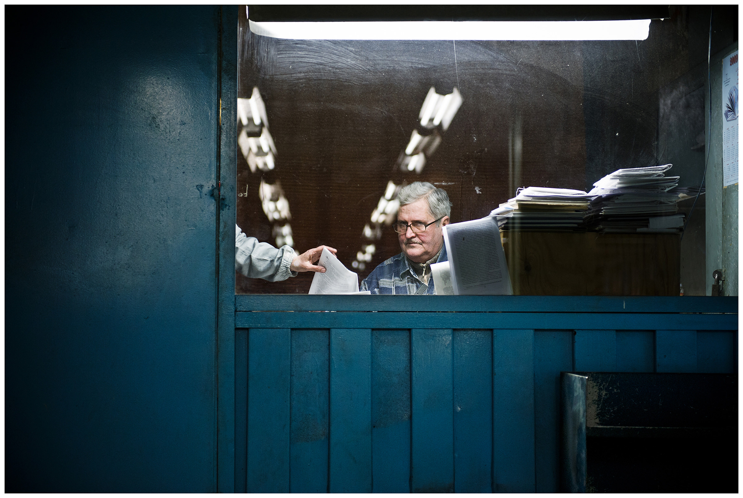 Minsk, Belarus, the publishing house "Pechatny Combinat". A print proofreader checks pages of the current issue of a magazine.