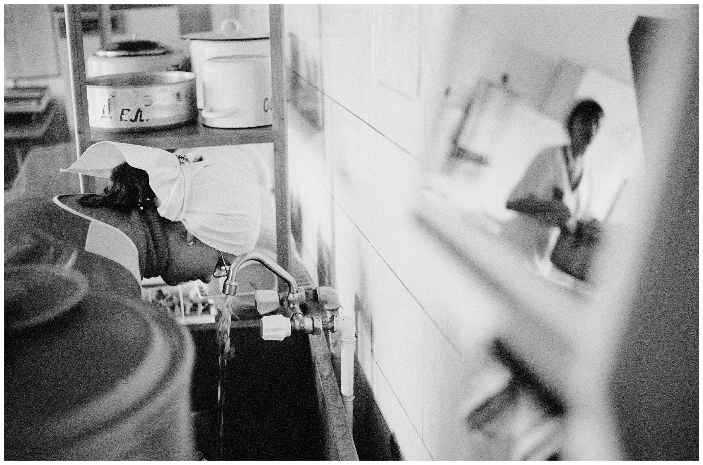 Minsk, Belarus. A psychophysically handicapped girl helps in the kitchen.