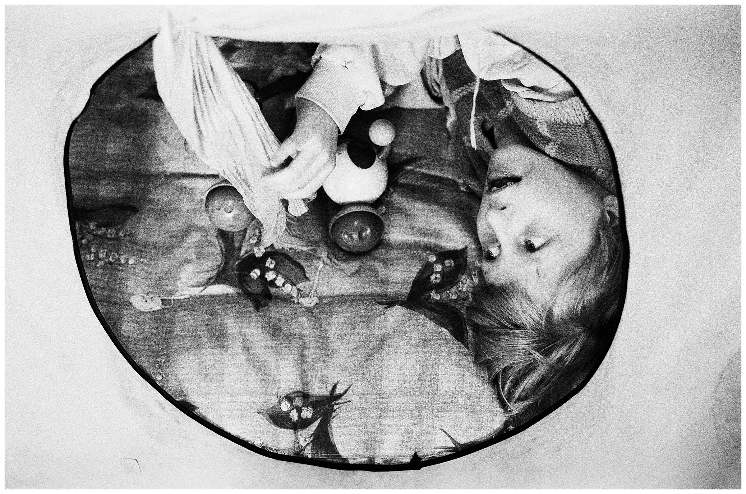 Minsk, Belarus. A psychophysically handicapped girl is playing in a tent.