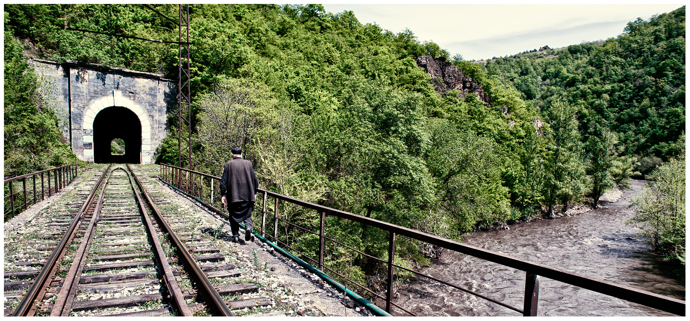 Imereti, Georgia. The Georgian monk Maxime Kavtaradze goes into mountains along the tracks to find a rock for his new home.