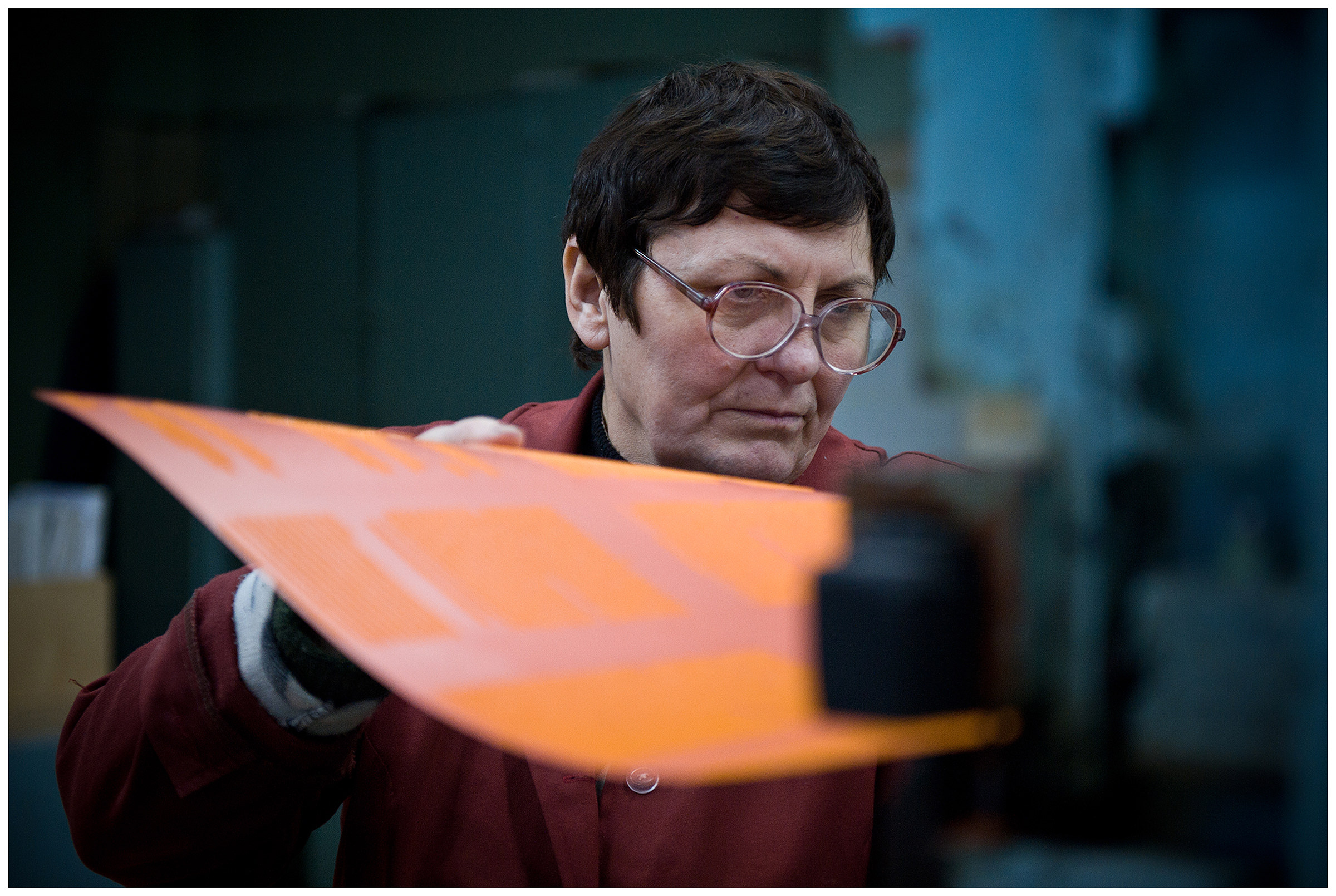 Minsk, Belarus, the publishing house "Pechatny Combinat". A worker produces a printing form.