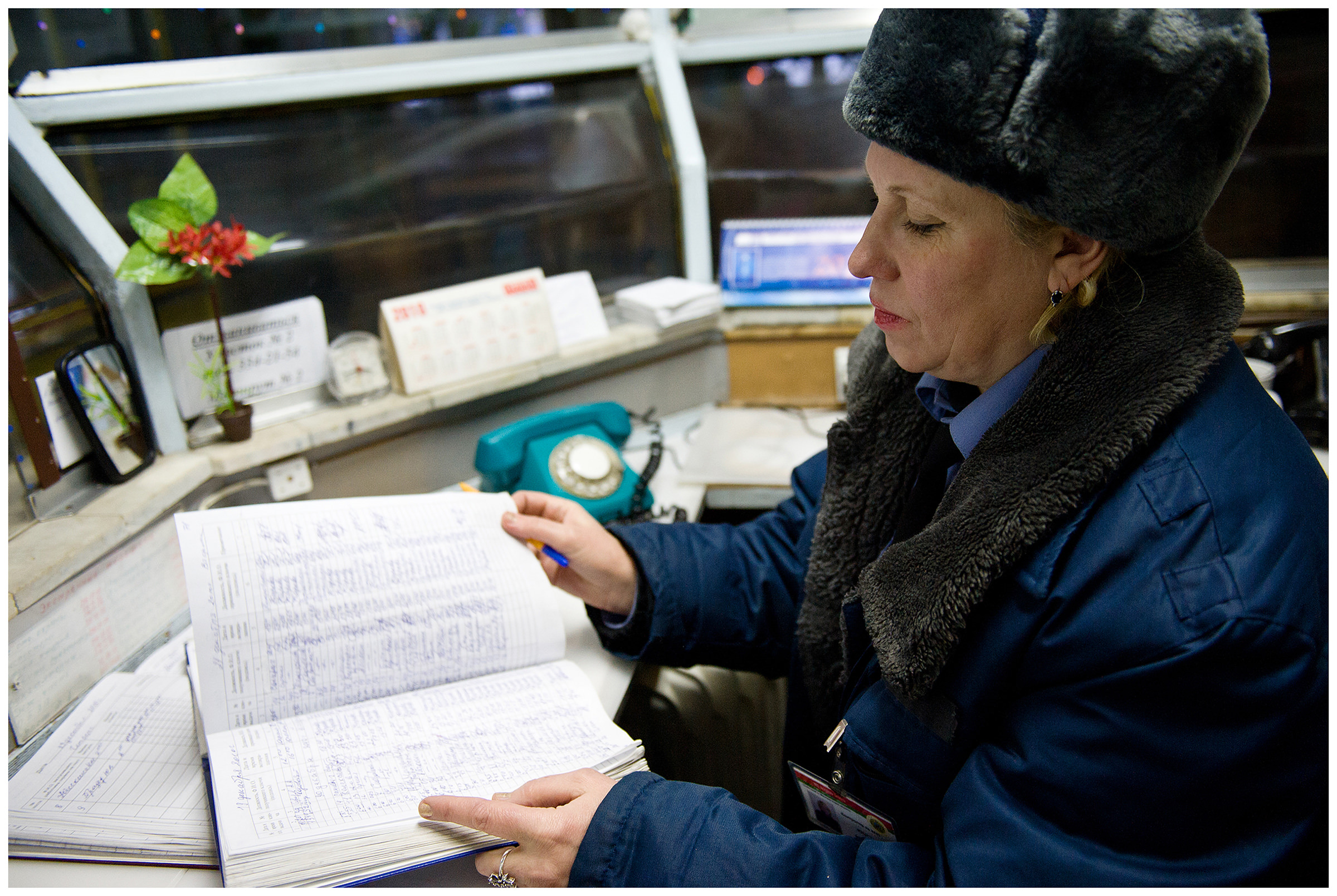Minsk, Belarus, the publishing house "Pechatny Combinat". A guard checks the lists of employees who have passed through the entrance door at the entrance to the publishing house.