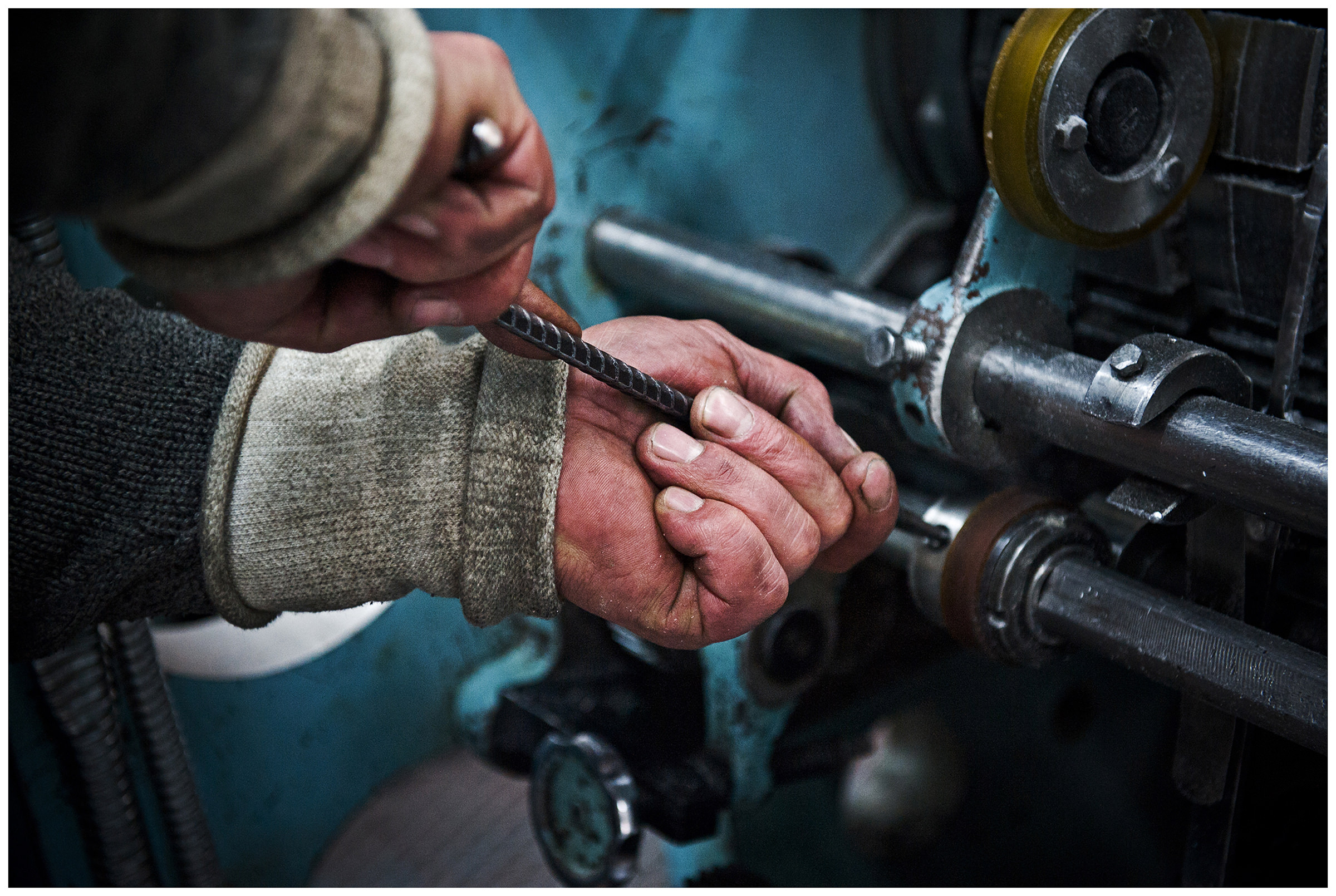 Minsk, Belarus, the publishing house "Pechatny Combinat". A technician repairs a printing press.