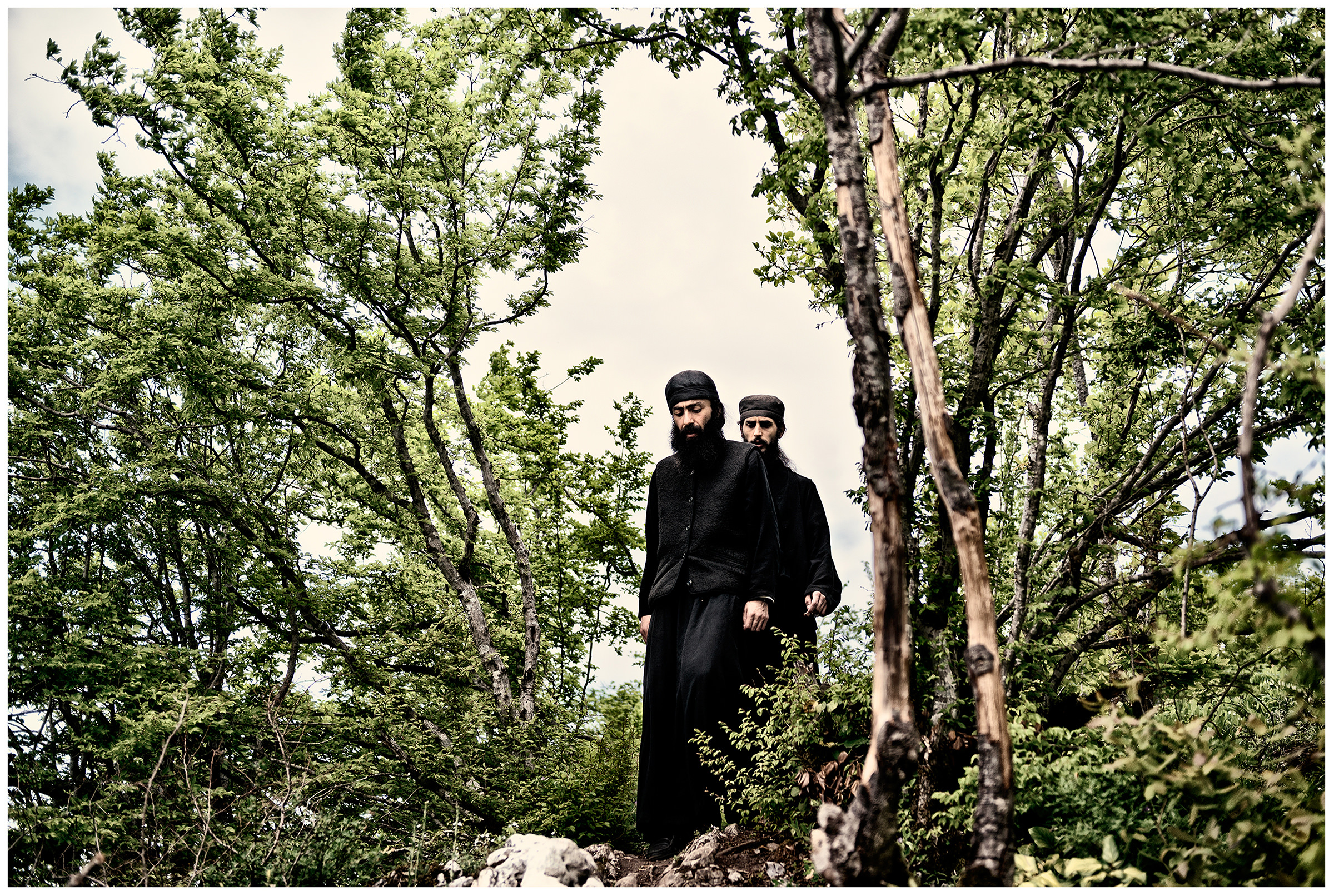 Imereti, Georgia. Two monks descend a rock.