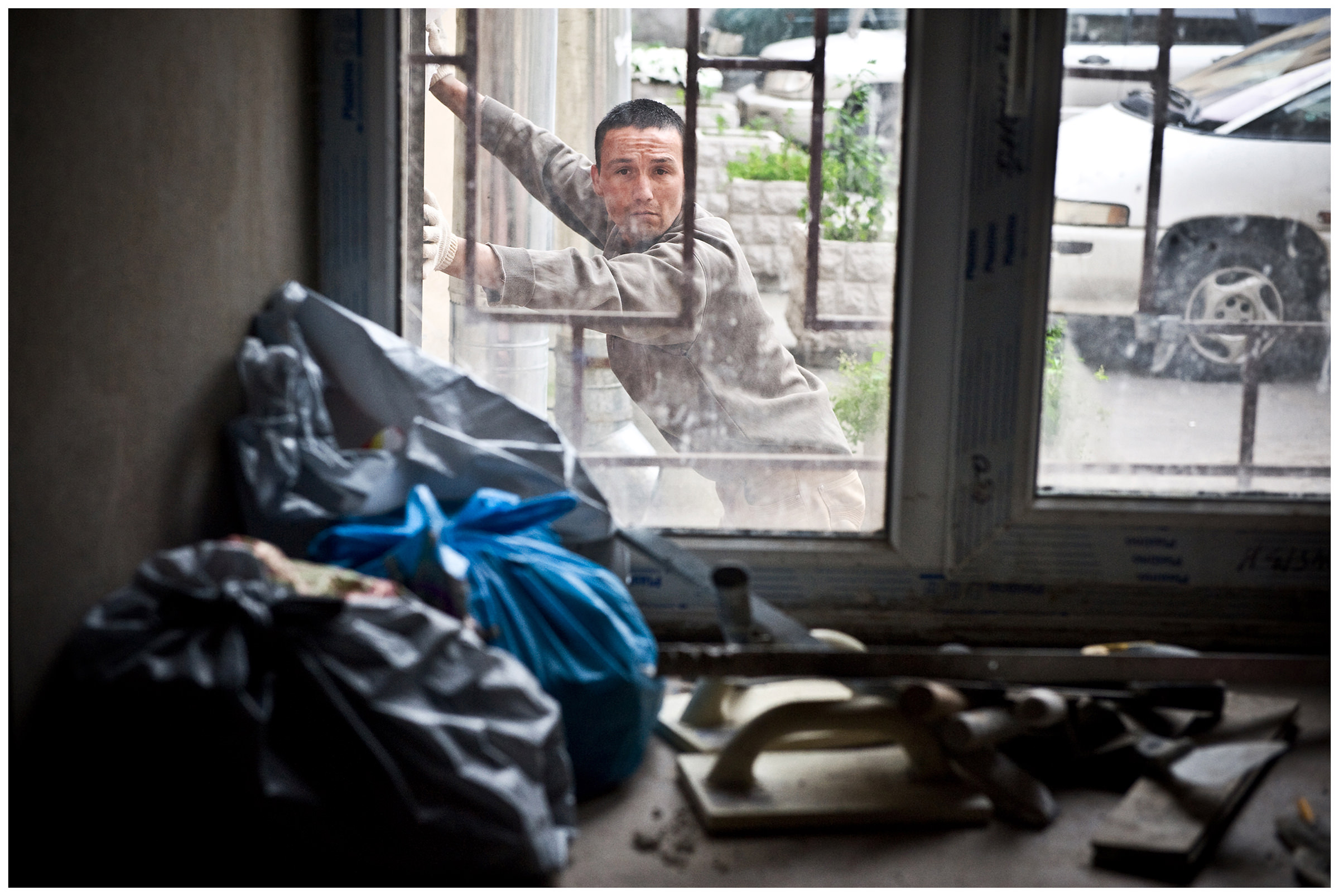 Saint Petersburg, Russia. An Uzbek guest worker takes a break at a construction site.