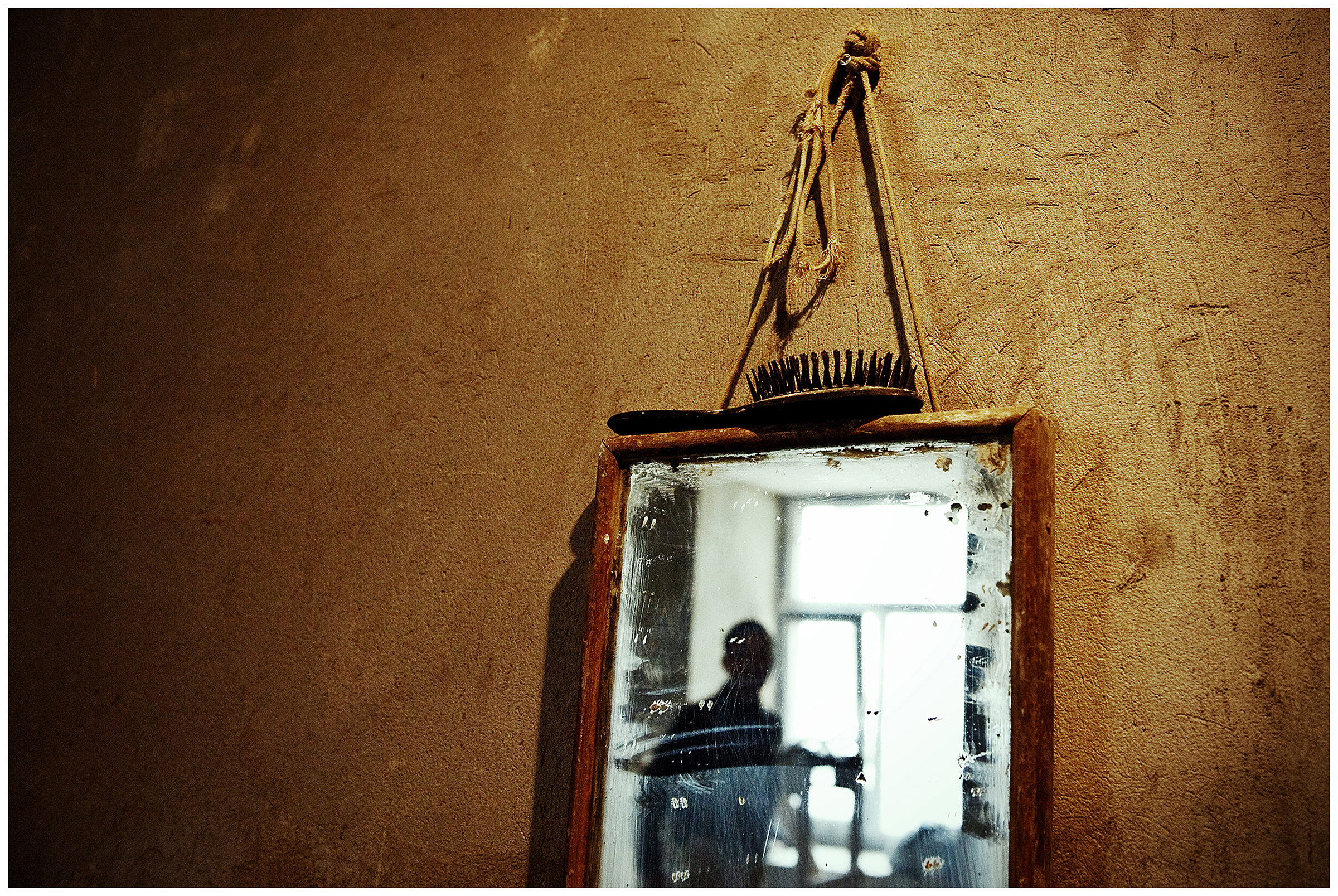 Saint Petersburg, Russia. A mirror hangs on the wall of a construction site.