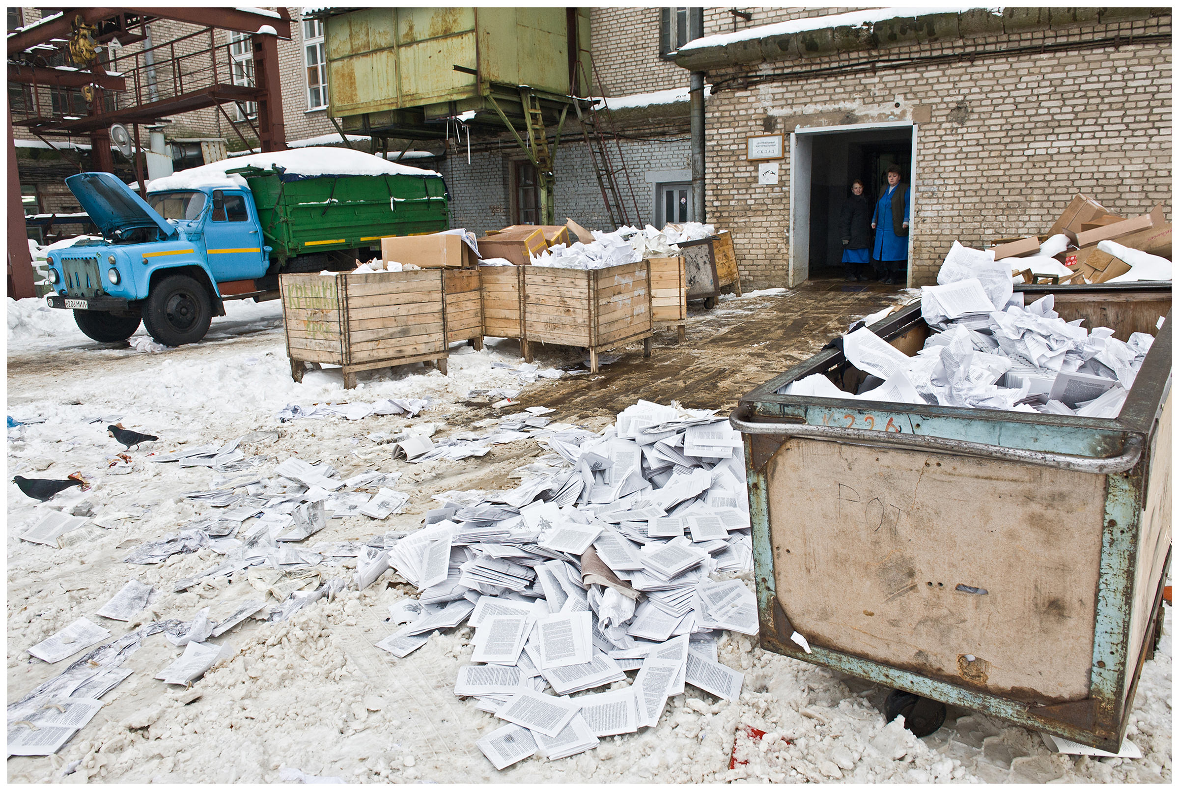 Minsk, Belarus, the publishing house "Pechatny Combinat". The sorted out print production lies in the backyard of the print shop in the snow.