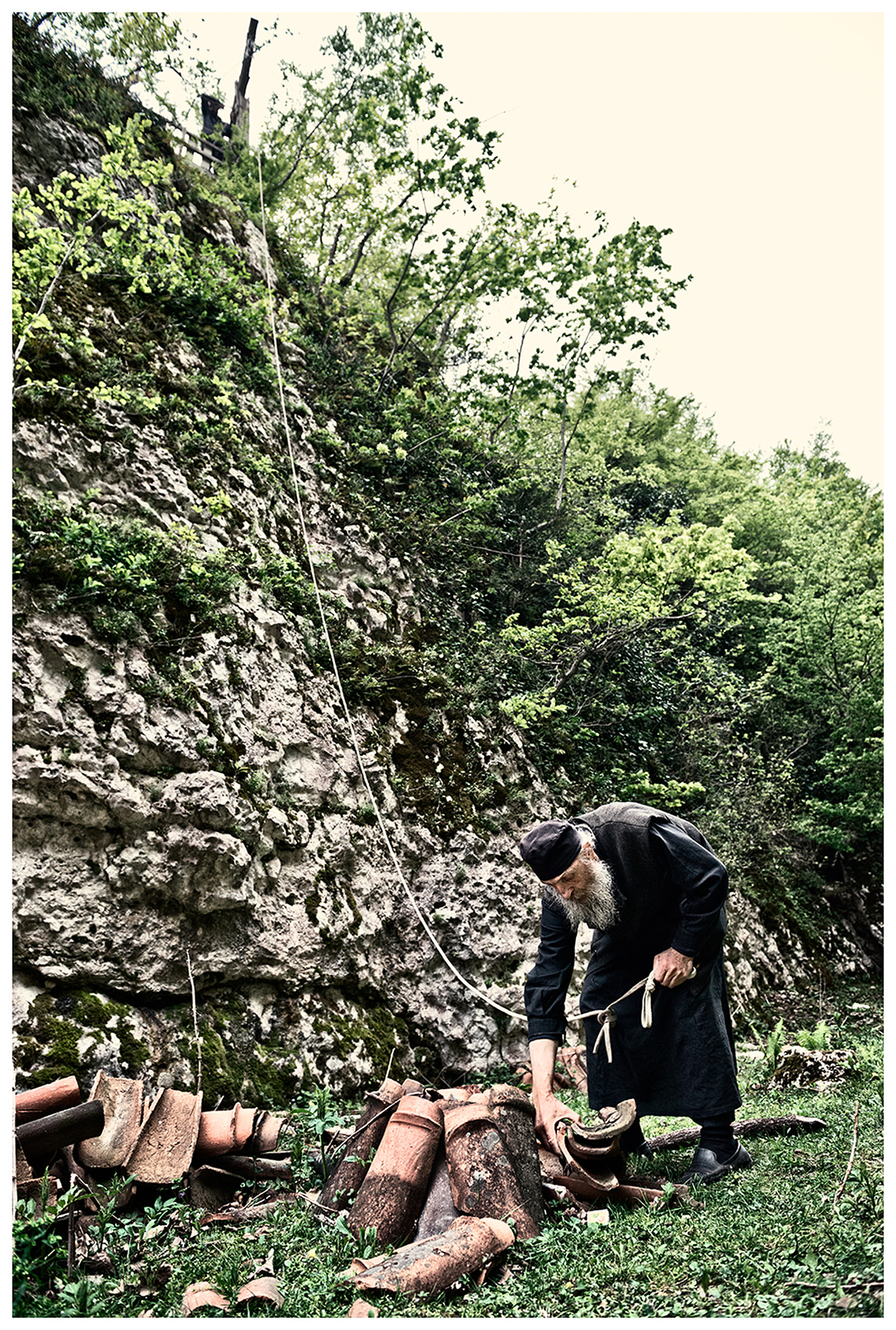 Imereti, Georgia. The Georgian monk Maxime Kavtaradze builds a house on a rock.