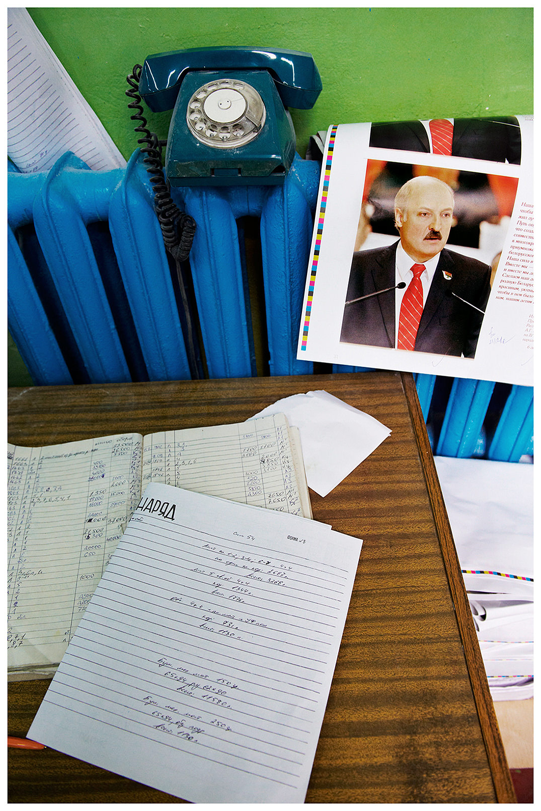 Minsk, Belarus, the publishing house "Pechatny Combinat". Propaganda production for the election campaign of Belarusian President Alexander Lukashenko. A test duck lies on a heating element in the print shop. On the table is a list with information on paper consumption.
