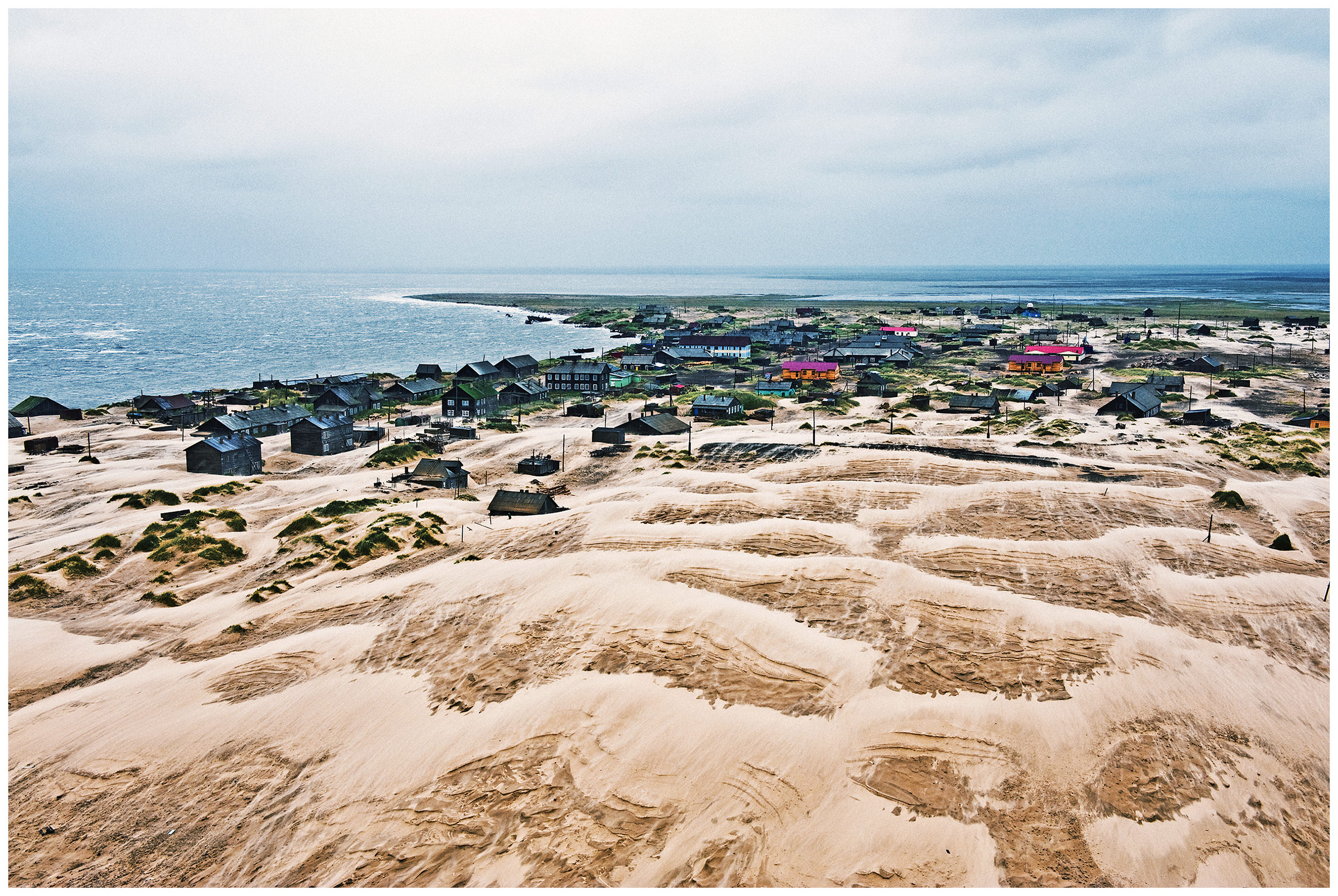 Shoyna village, Russia. An overview of the village with sand dunes from a lighthouse.