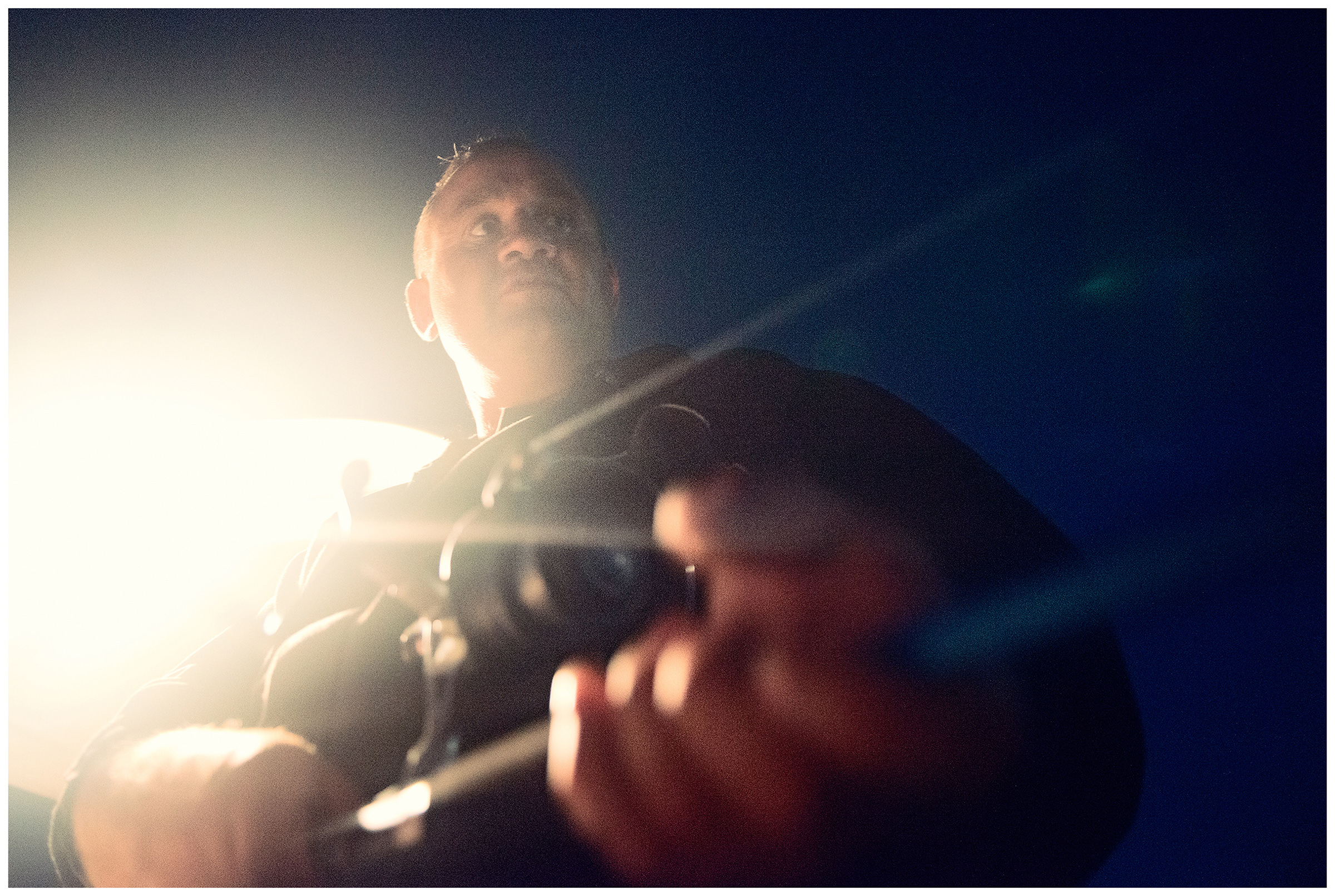 Village Posyet, Primorye, Russia. A poacher catches squid at night.