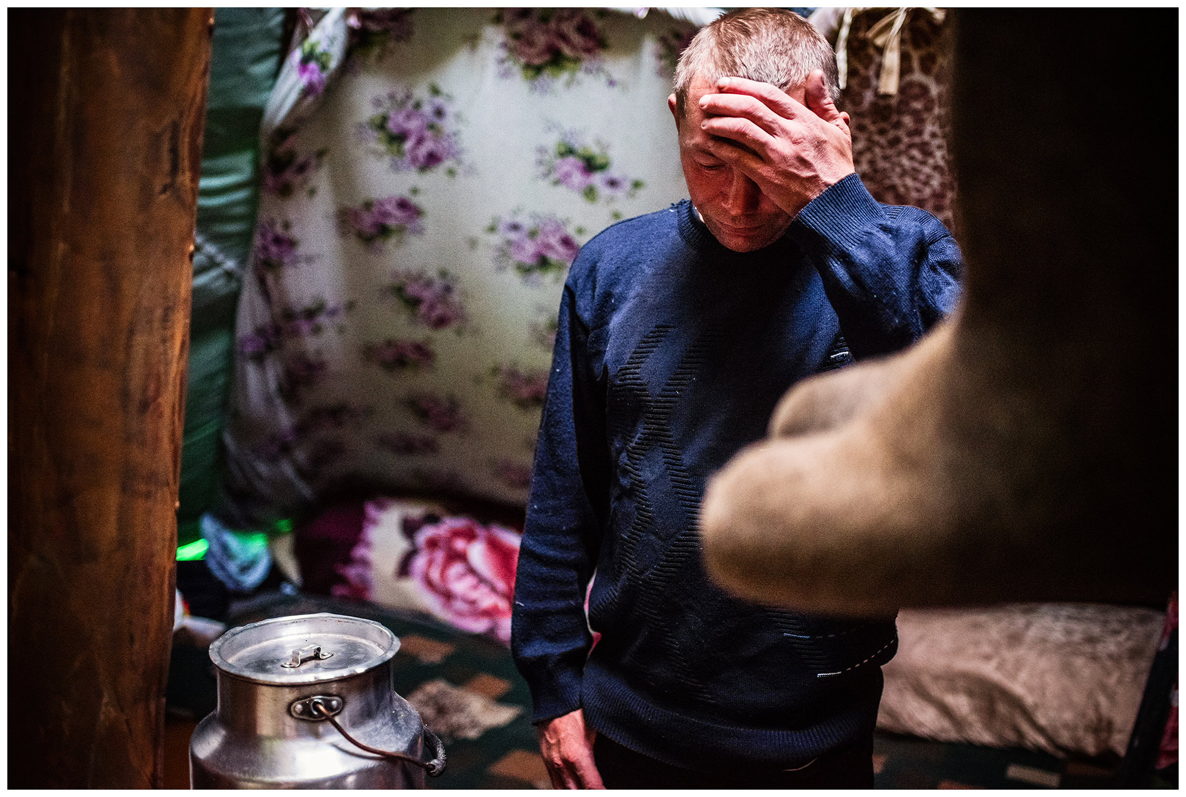 Nenets Autonomous Okrug, Komi Republic, Russia. A reindeer herder stands in his tent.