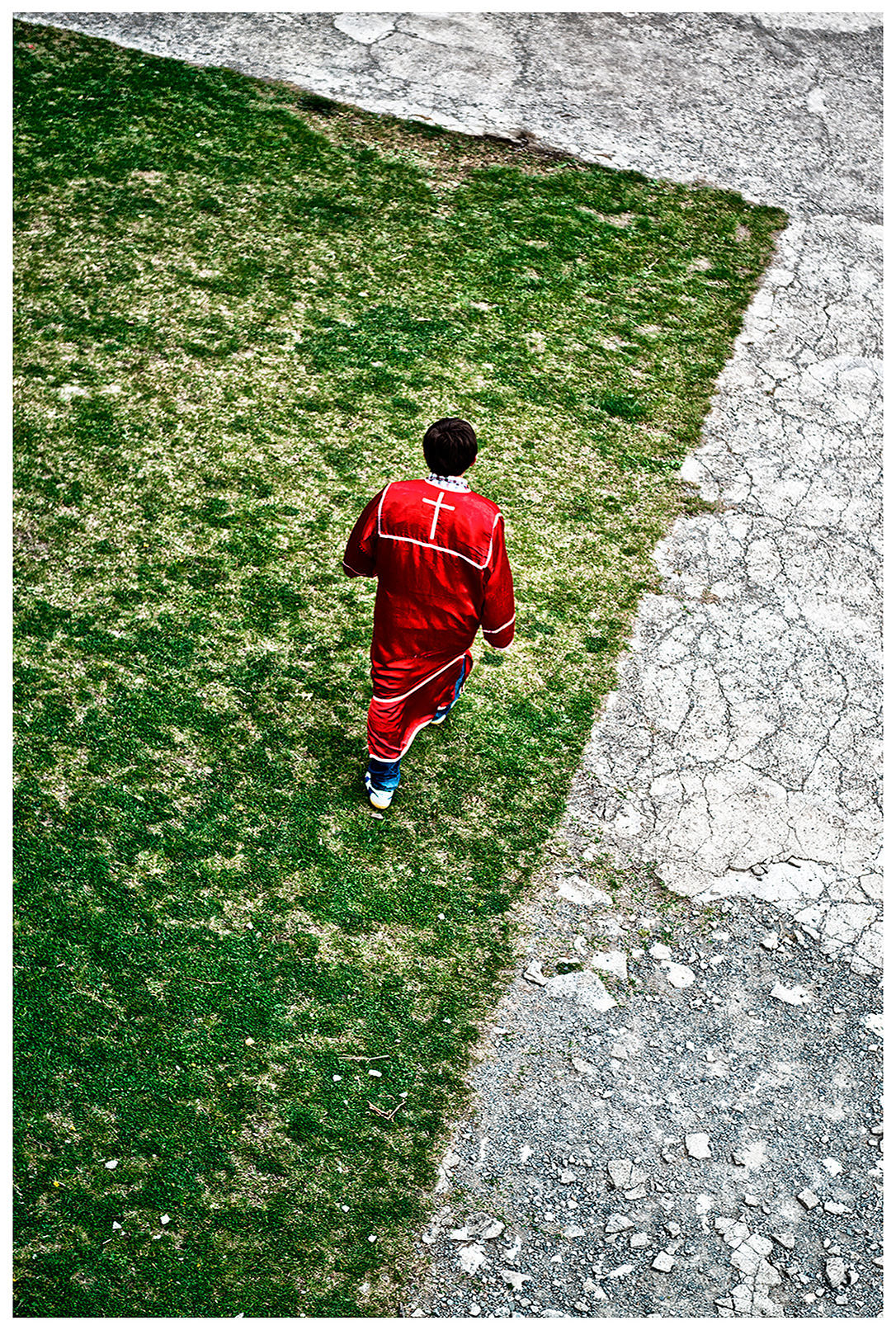 Imereti, Georgia. A boy in ecclesiastical garb goes to a monastery.