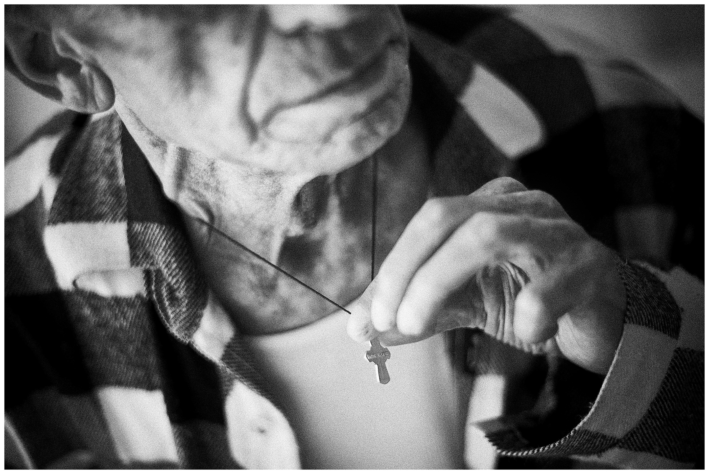 Minsk Hospice, Minsk, Belarus. A patient shows his cross to his wife.