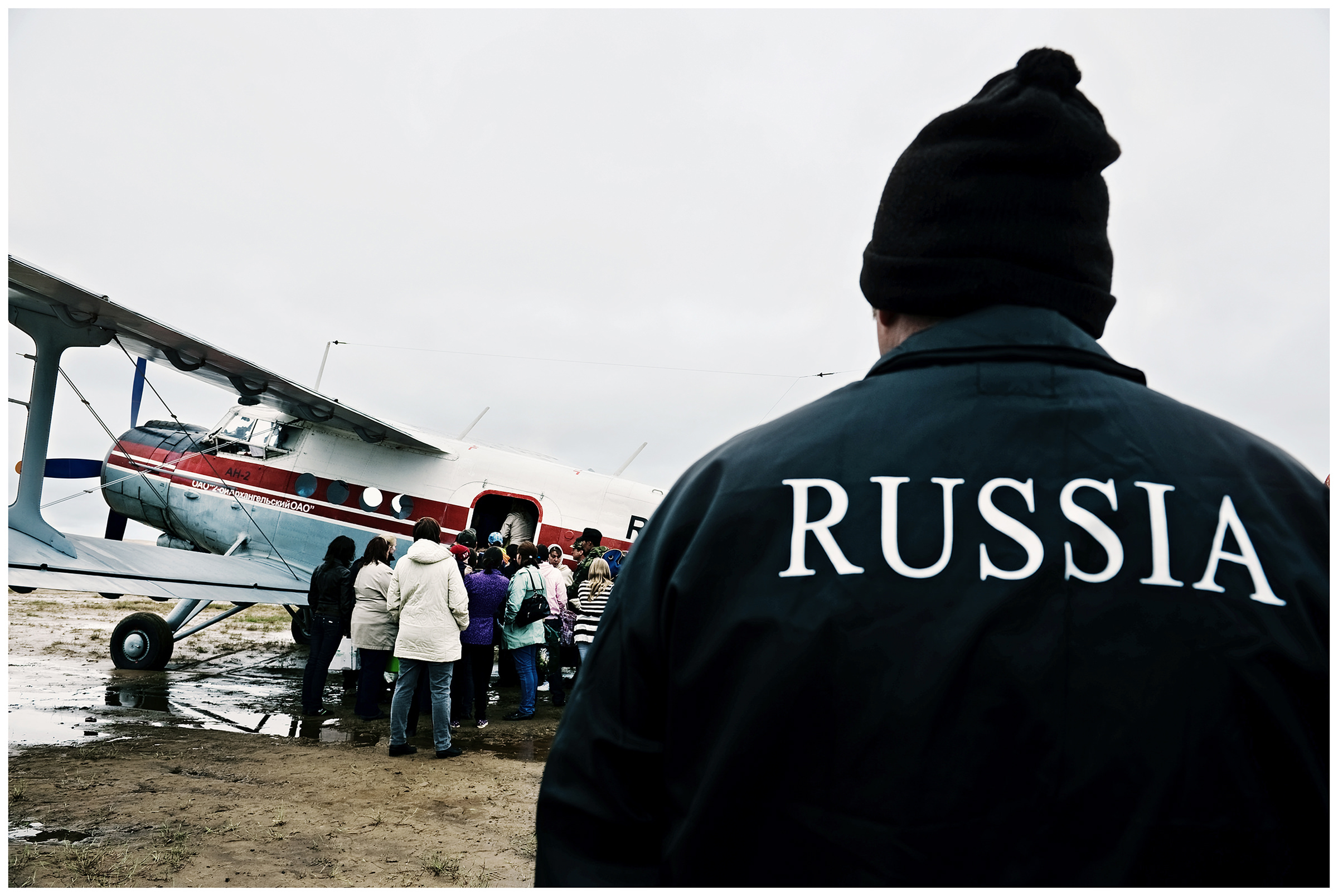Shoyna village, Russia. People take leave of their relatives who board the plane.
