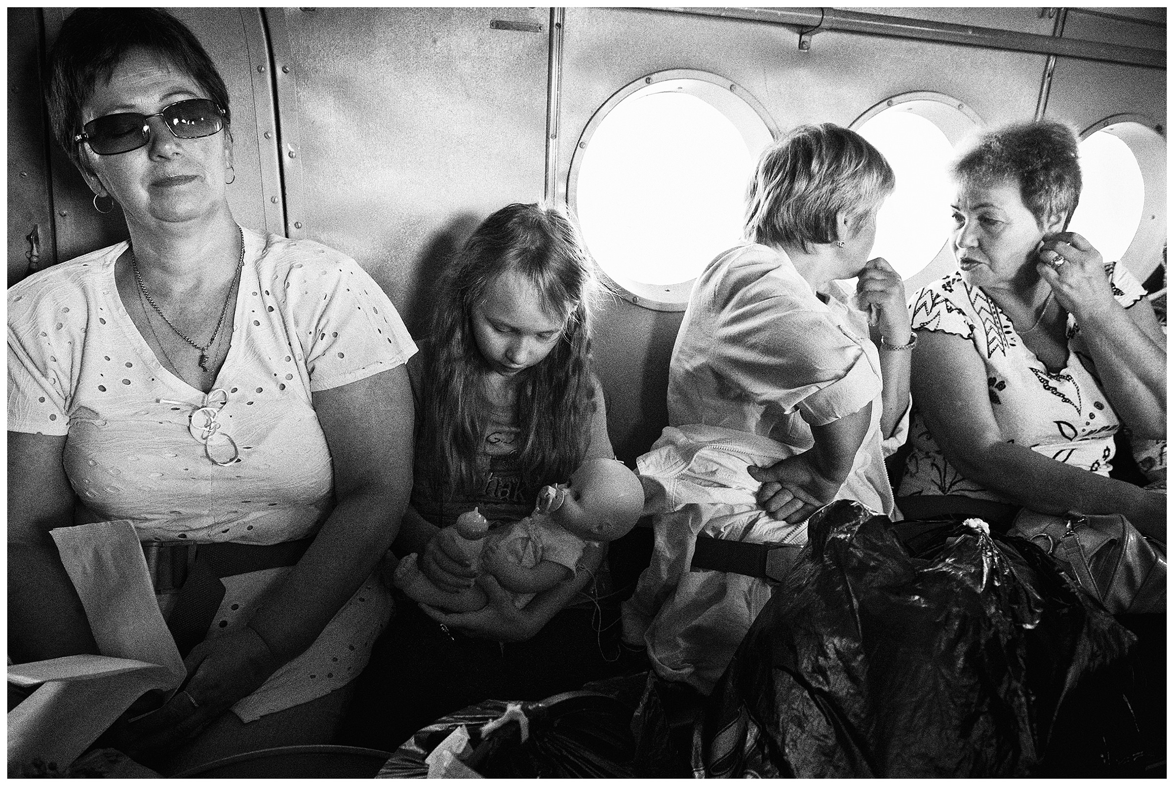 Shoyna village, Russia. Passengers are sitting in a plane.