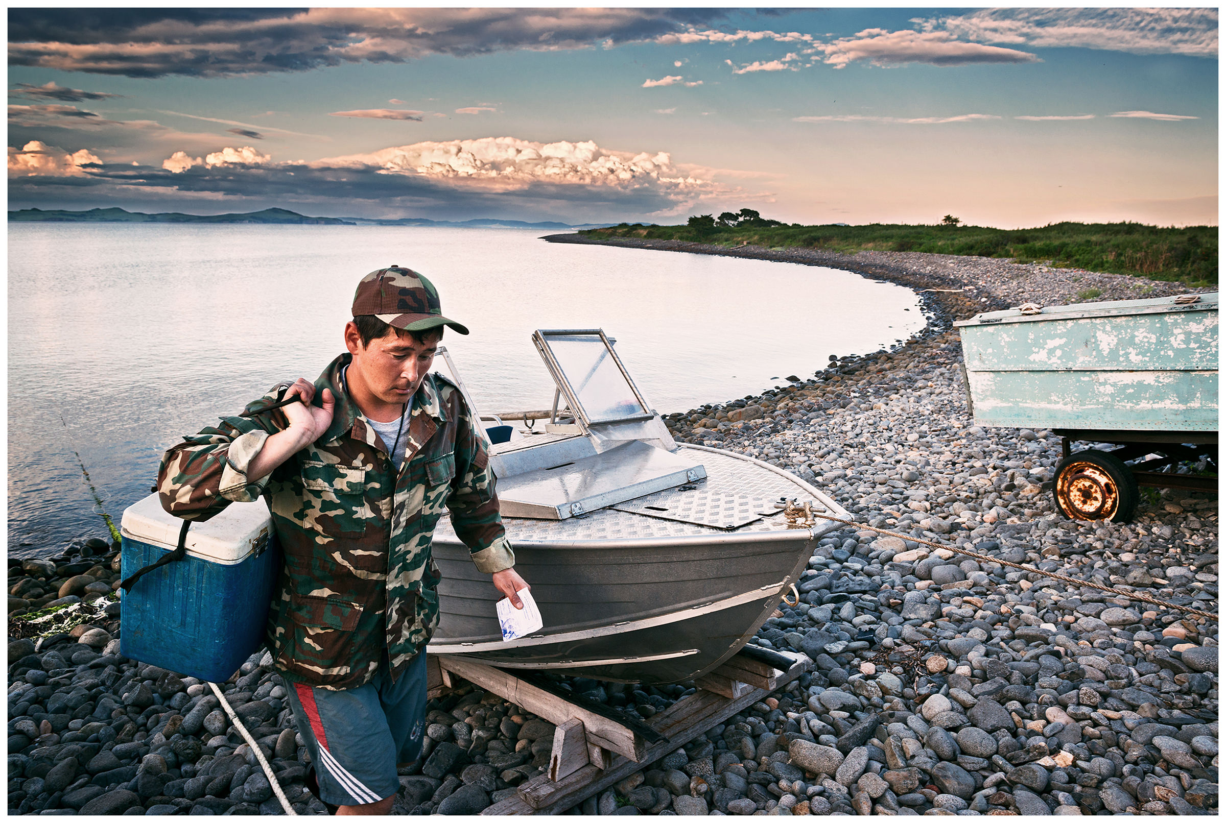 Pemzovaya Bay, Primorye, Russia. A nature conservation inspector carries a waterproof box with the important documents to his nature conservation post.