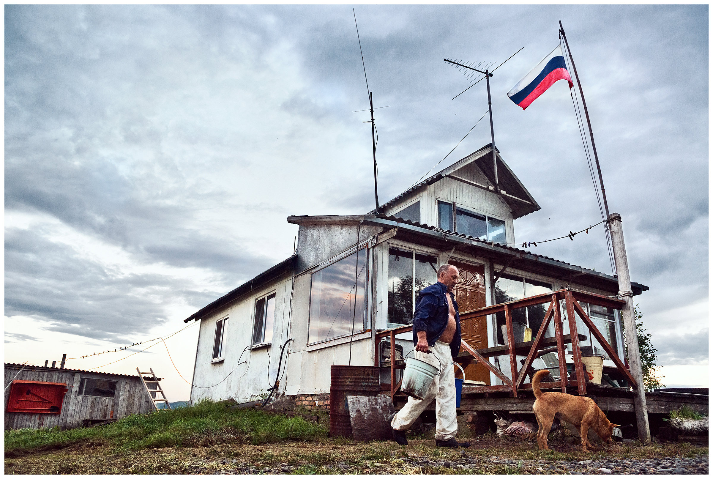 Bay Pemzowaya, Primorye, Russia. A border guard fetches water to prepare dinner.