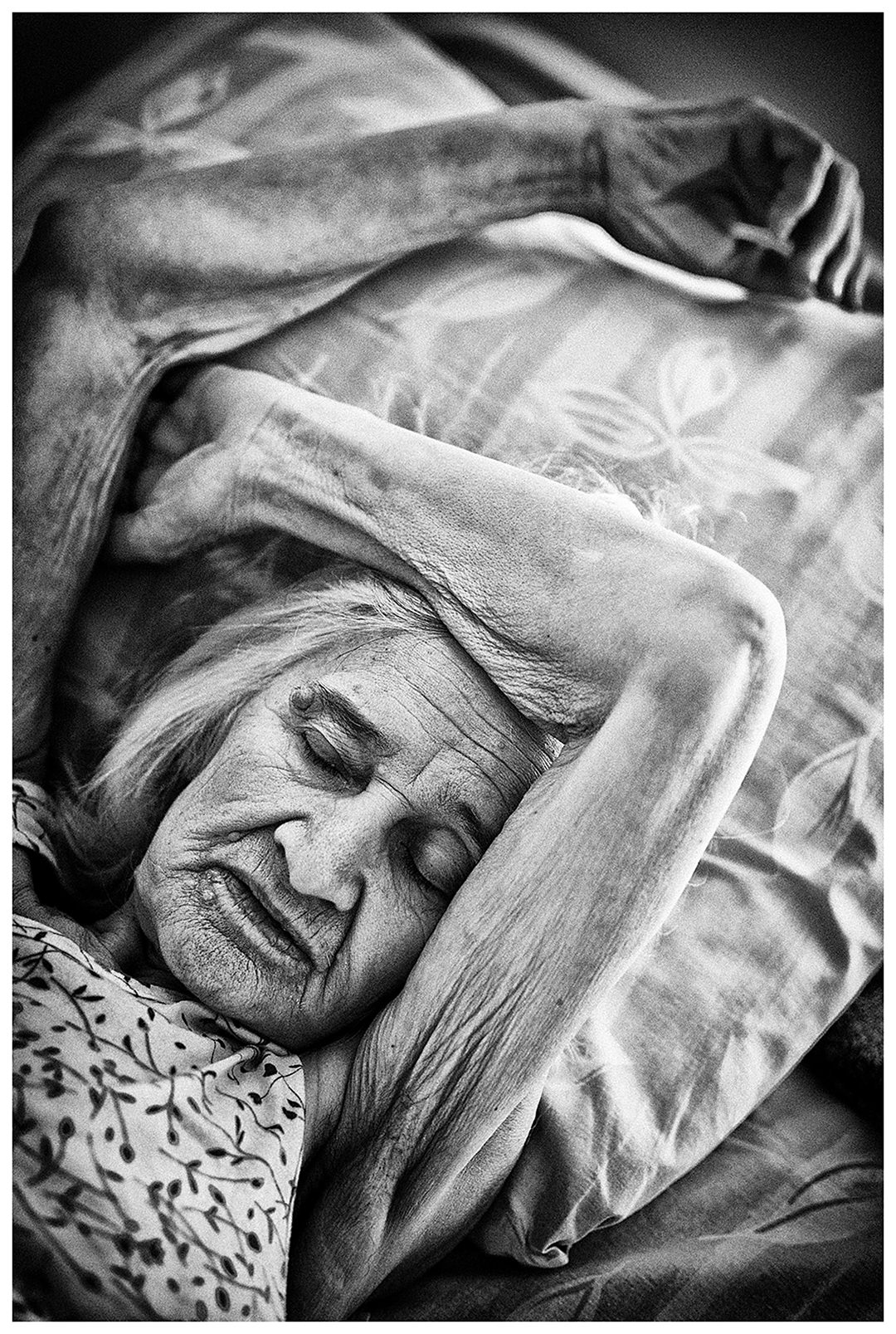 Minsk Hospice, Minsk, Belarus. A patient is sleeping.