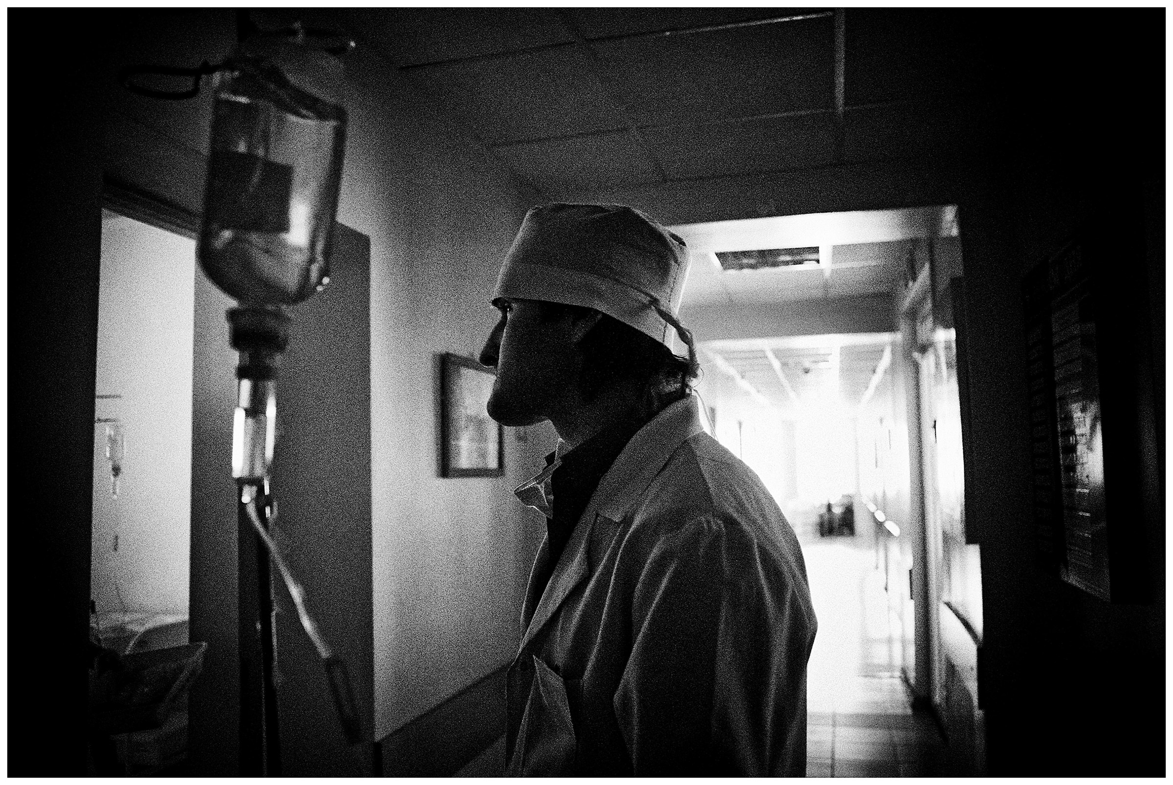 Minsk Hospice, Minsk, Belarus. An intern is waiting in the corridor for his colleagues.