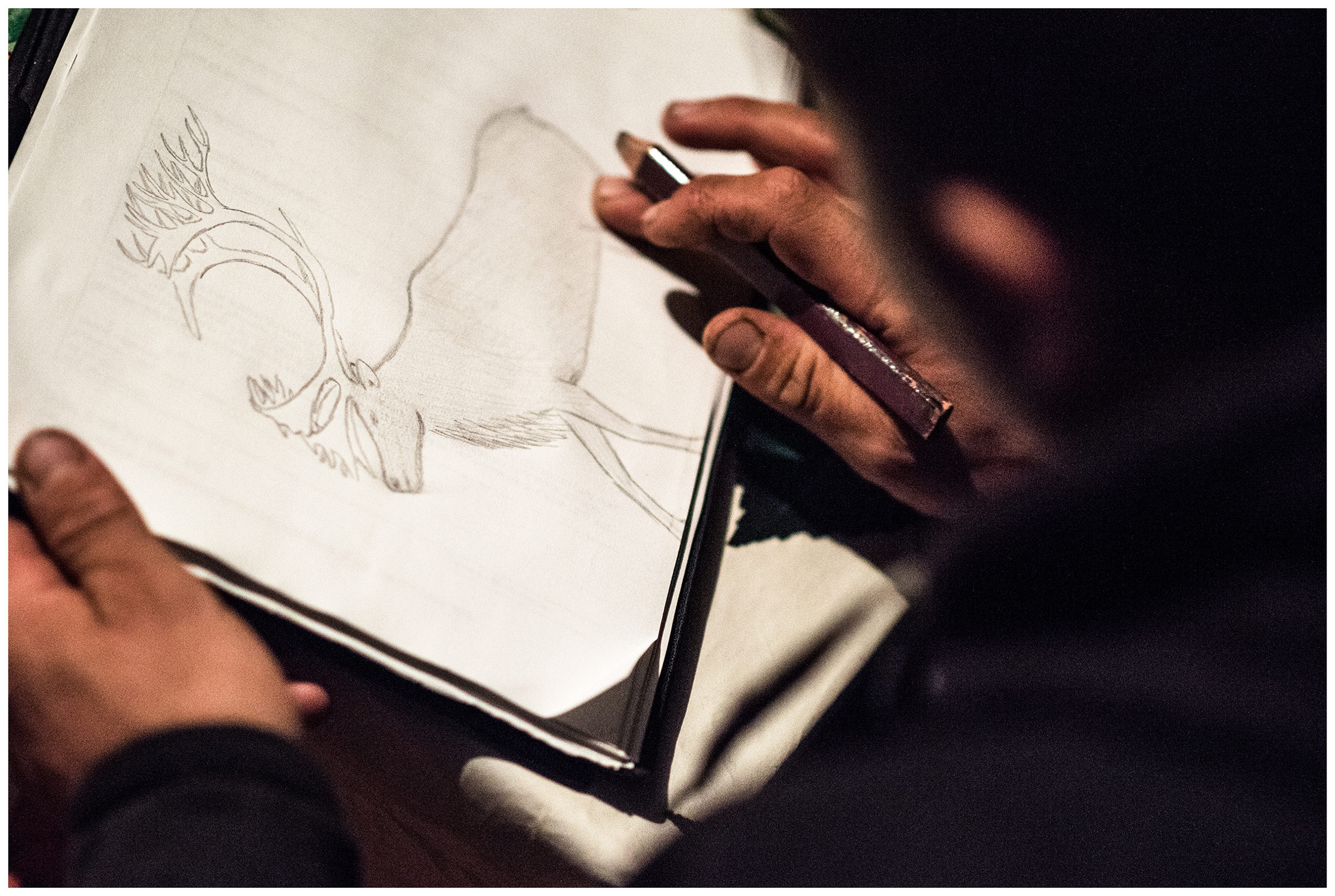 Nenets Autonomous Okrug, Komi Republic, Russia. A reindeer herder paints a reindeer in a painting block.
