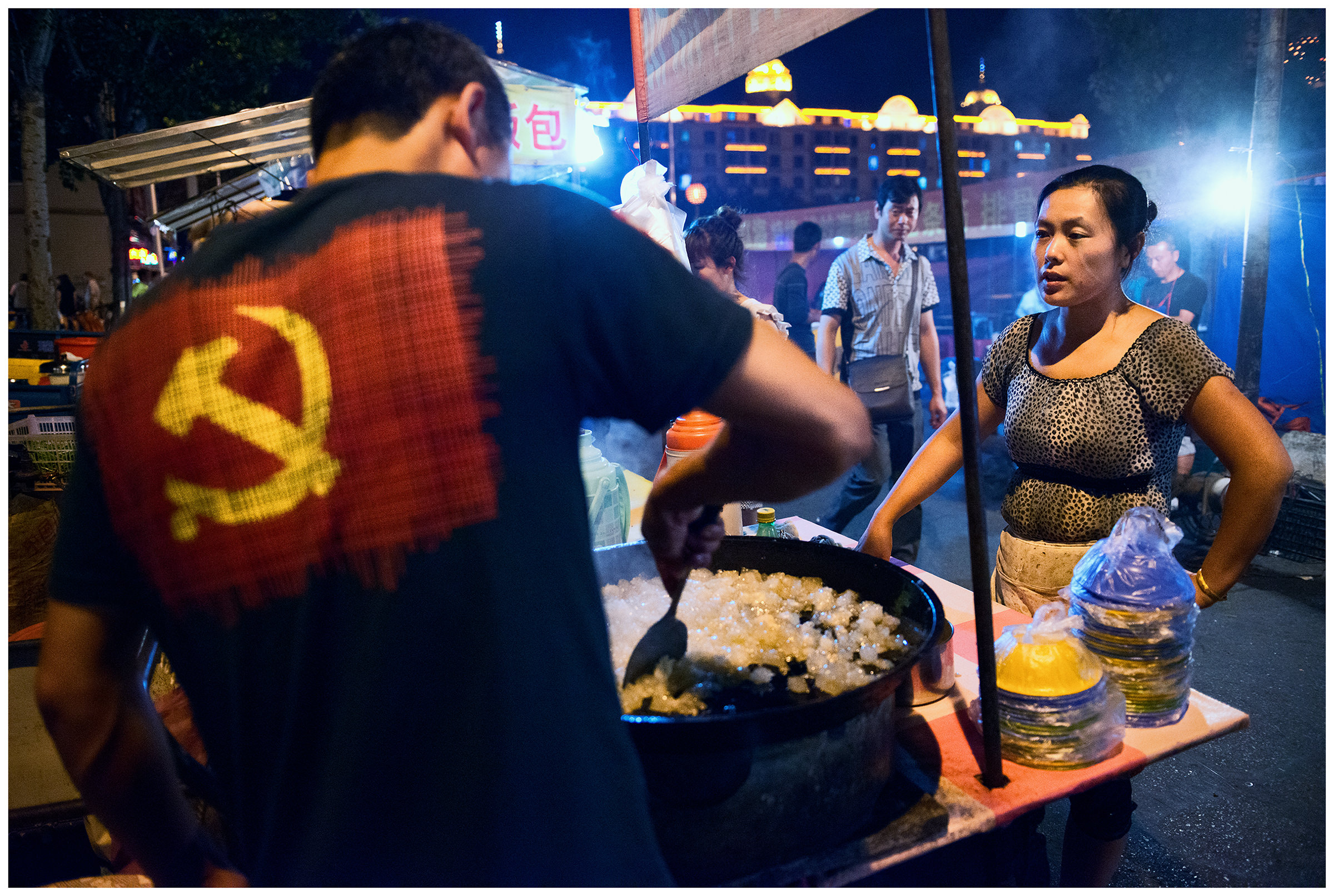 Hunchun, China. A man prepares seafood at the fish market. Most of the delicacies sold and prepared at the Hunchun fish market in China come from Russia.