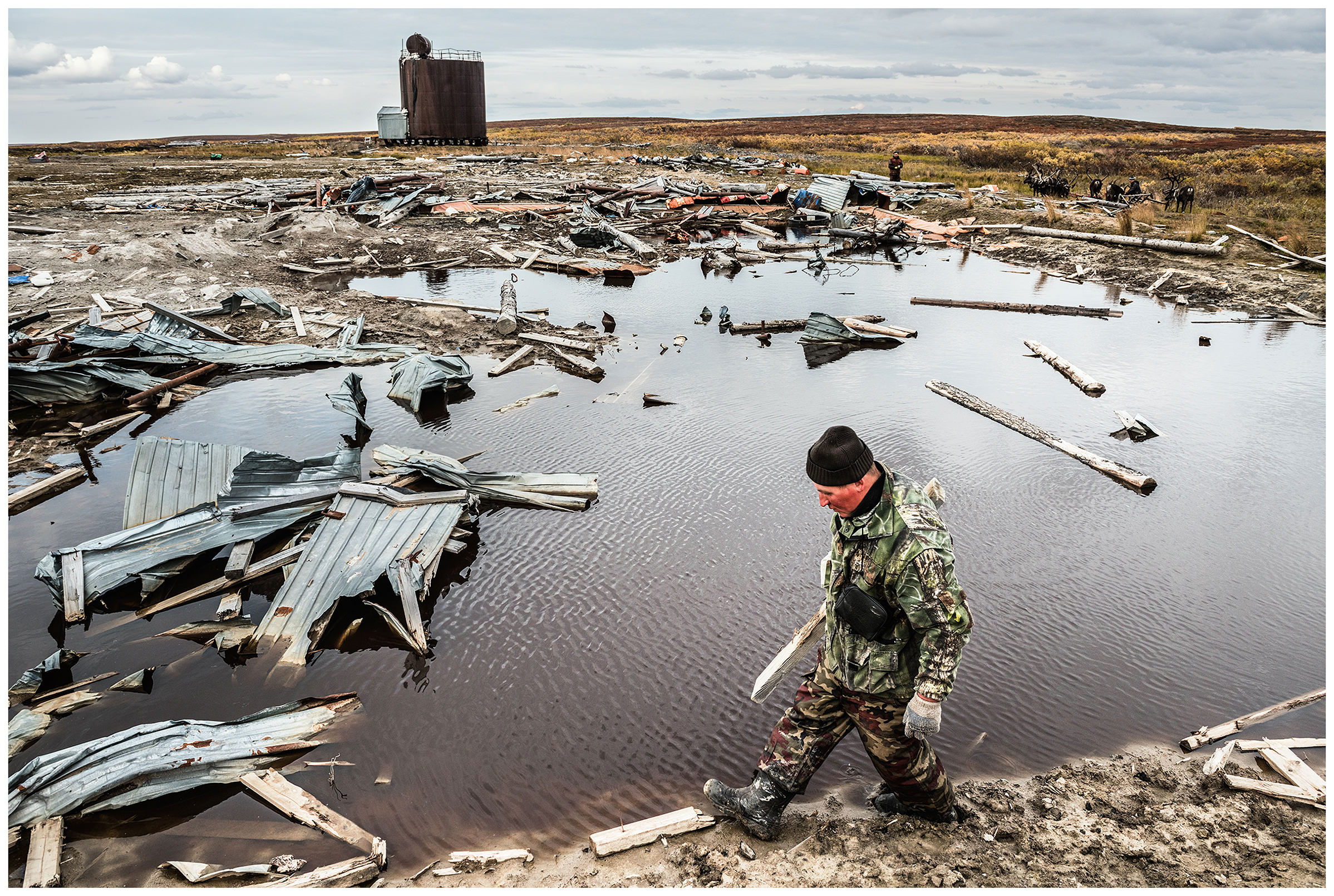 Nenets Autonomous Okrug, Komi Republic, Russia. Komi nomads gather in the tundra garbage that oil field workers have left behind.