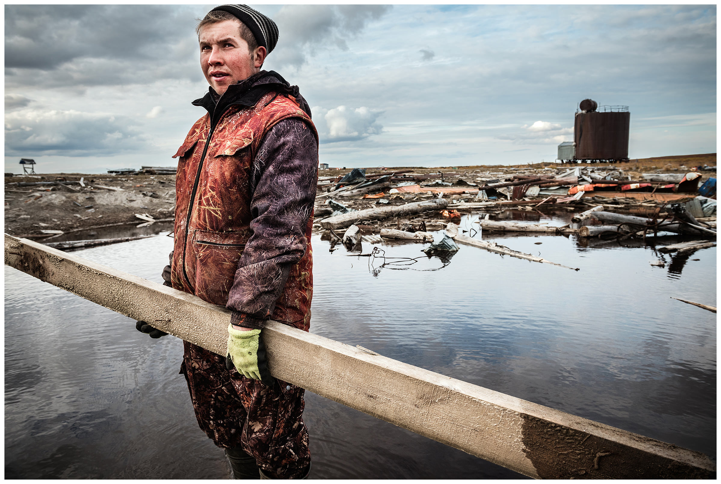 Nenets Autonomous Okrug, Komi Republic, Russia. Komi nomads gather in the tundra garbage that oil field workers have left behind.