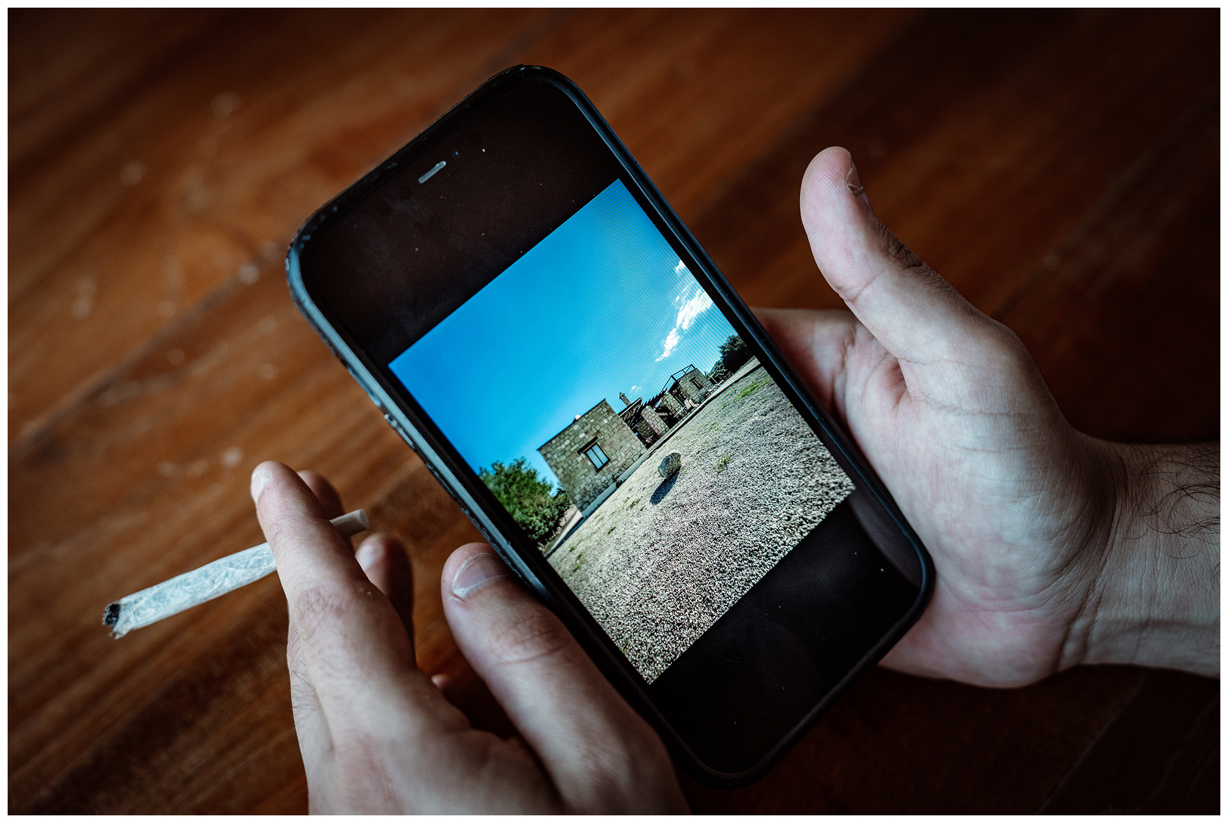 Miliou, Cyprus. An Israeli shows a photo on his smartphone that he took in the Wellness Retreat Secret Forest.