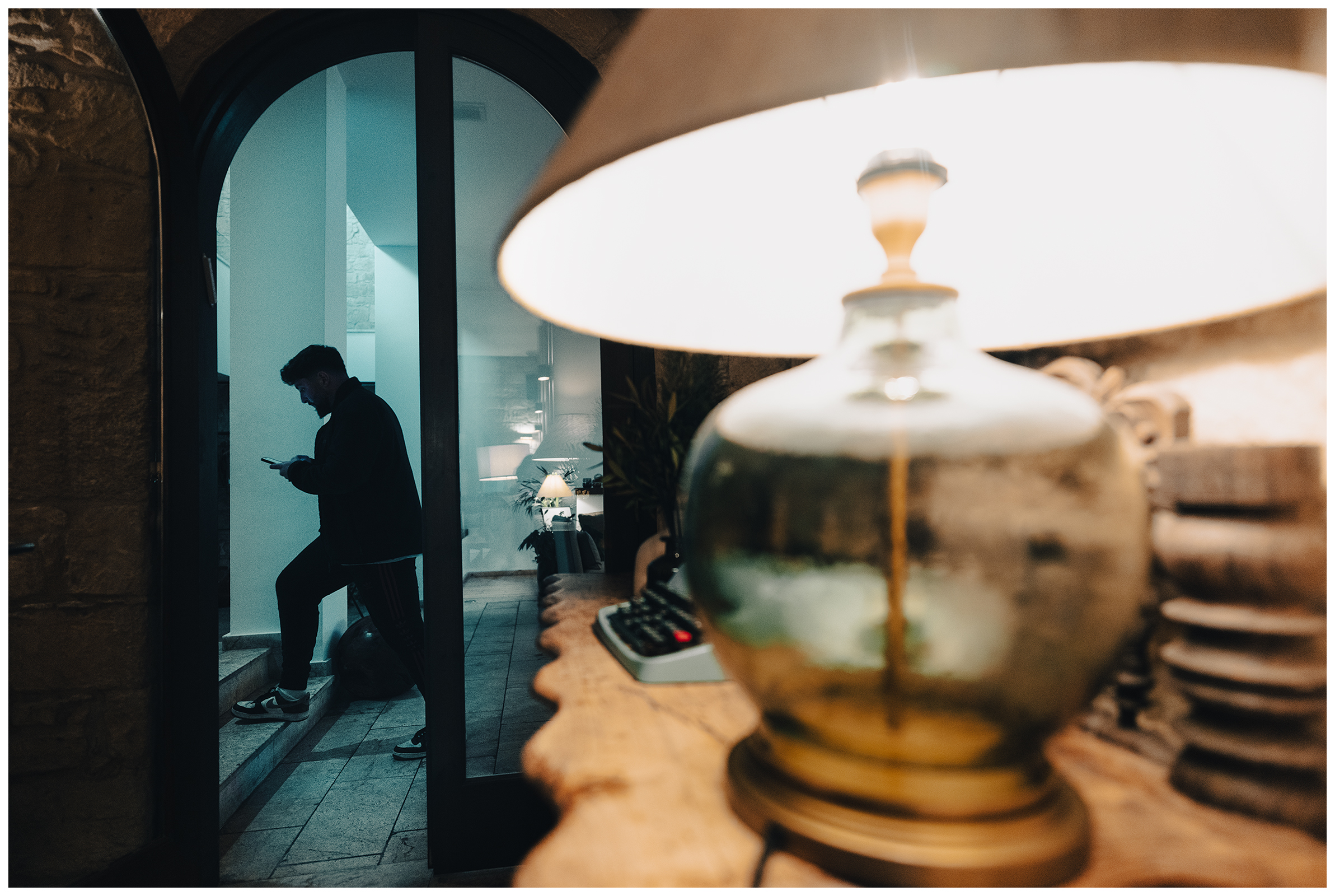 Miliou, Cyprus. An Israeli walks in a stairwell with a smartphone in his hand in the Secret Forest wellness retreat.