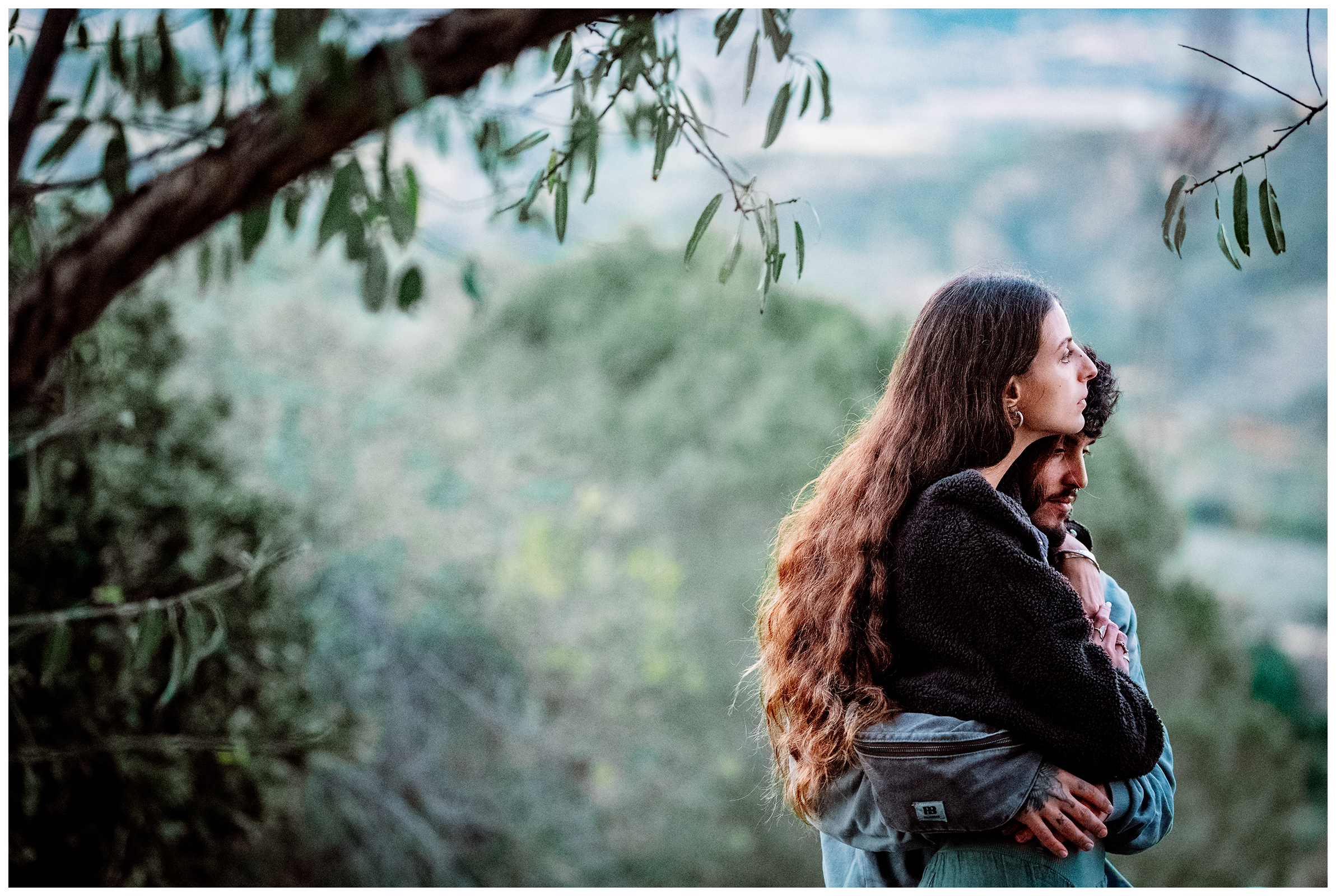 Miliou, Cyprus. A young Israeli woman and a young Israeli man hug at the Secret Forest wellness retreat.